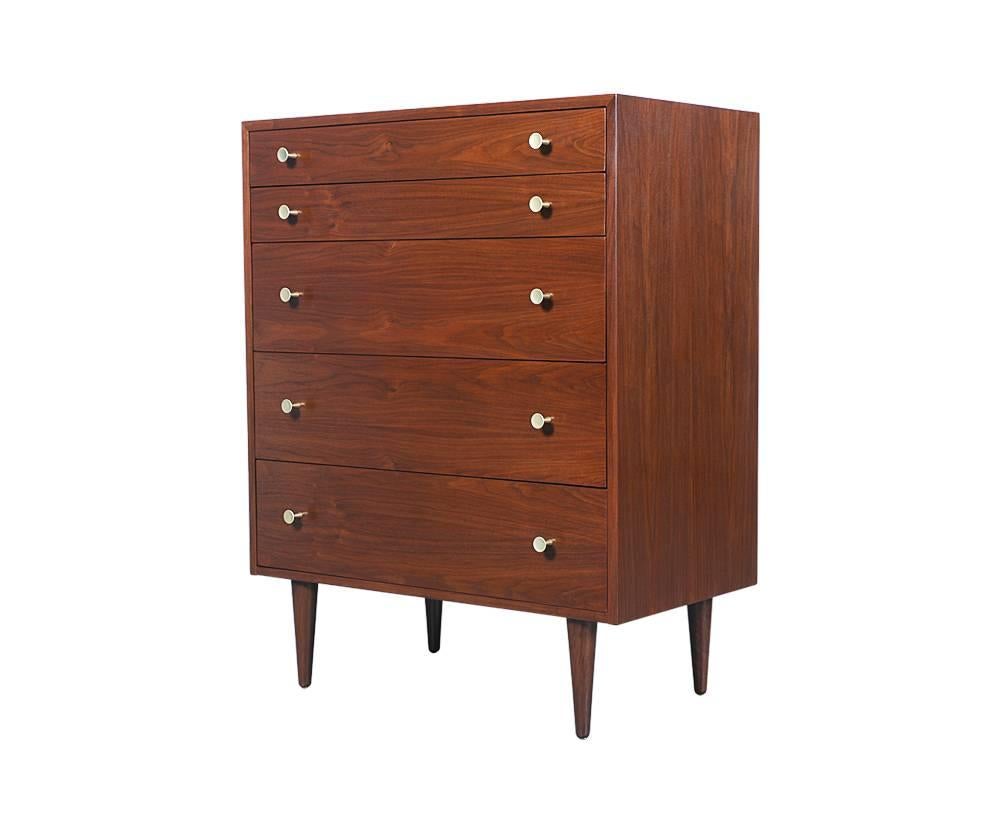 Designer: Attributed to Kipp Stewart or Stuart MacDougall 
Period/Style: Mid-Century Modern
Country: United States
Date: 1950s

Dimensions: 41.5?H x 32.75?W x 17.75?D
Materials: Walnut, brass pulls
Condition: Excellent – newly refinished
Number of