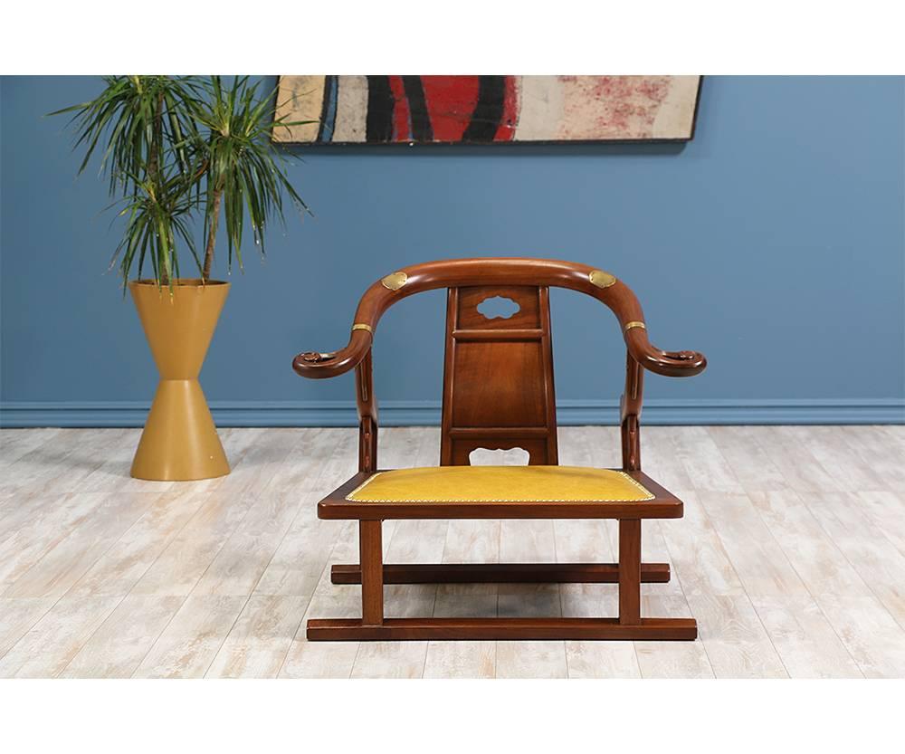 Designer: Michael Taylor
Manufacturer: Baker “Far East Collection”
Period/Style: Mid-Century Modern
Country: United States
Date: 1950s

Dimensions: 26.25?H x 31.25?W x 25?D
Seat height 10.5?
Materials: Walnut wood, brass, leather
Condition: