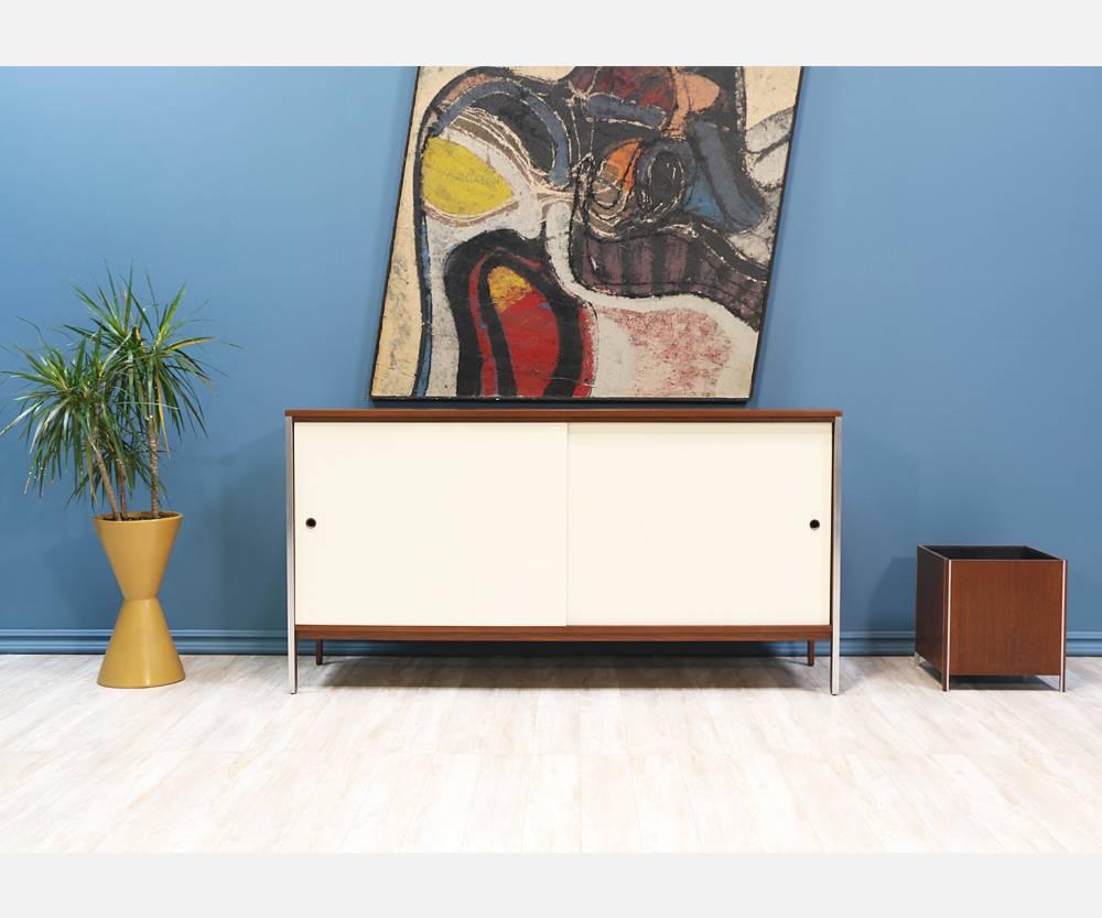 Designer: Paul McCobb
Manufacturer: Calvin Furniture “Linear Group”
Period/Style: Mid-Century Modern
Country: United States
Date: 1954.

Dimensions: 34.5? H x 66? L x 18? W.
Materials: Walnut wood, aluminium accents, lacquered doors
Condition: