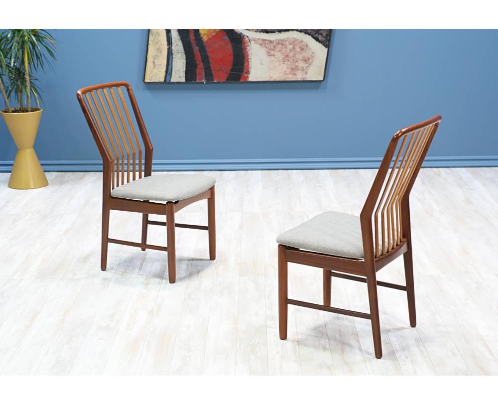 Set of 4 dining chairs with sculptural, slatted backs in a beautiful contrast of teak and beech wood. Seat rests have new foam and a muted grey, tweed fabric.