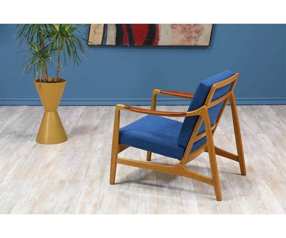 Designer: Tove & Edvard Kindt-Larsen
Manufacturer: France & Daverkosen
Period/style: Danish Modern
Country: Denmark
Date: 1950s

Dimensions: 29?H x 27.5?W x 31?D
Seat height 15?
Materials: Teak wood, oak wood, tweed fabric
Condition: