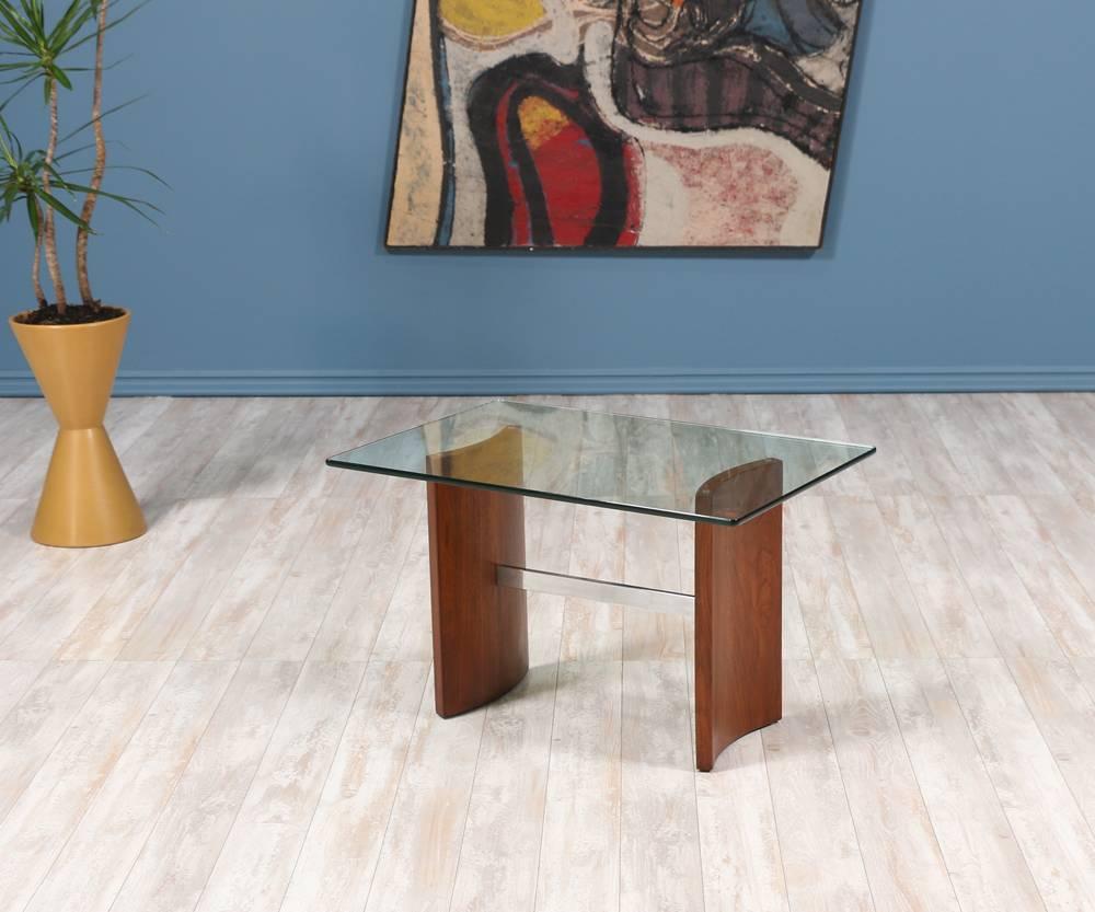 Mid-Century Modern Propeller side table designed by German-born architect and furniture designer, Vladimir Kagan, for Selig in the 1950’s. Its clean and geometric lines represent Kagan’s aesthetic. Made of a newly refinished walnut base connected by