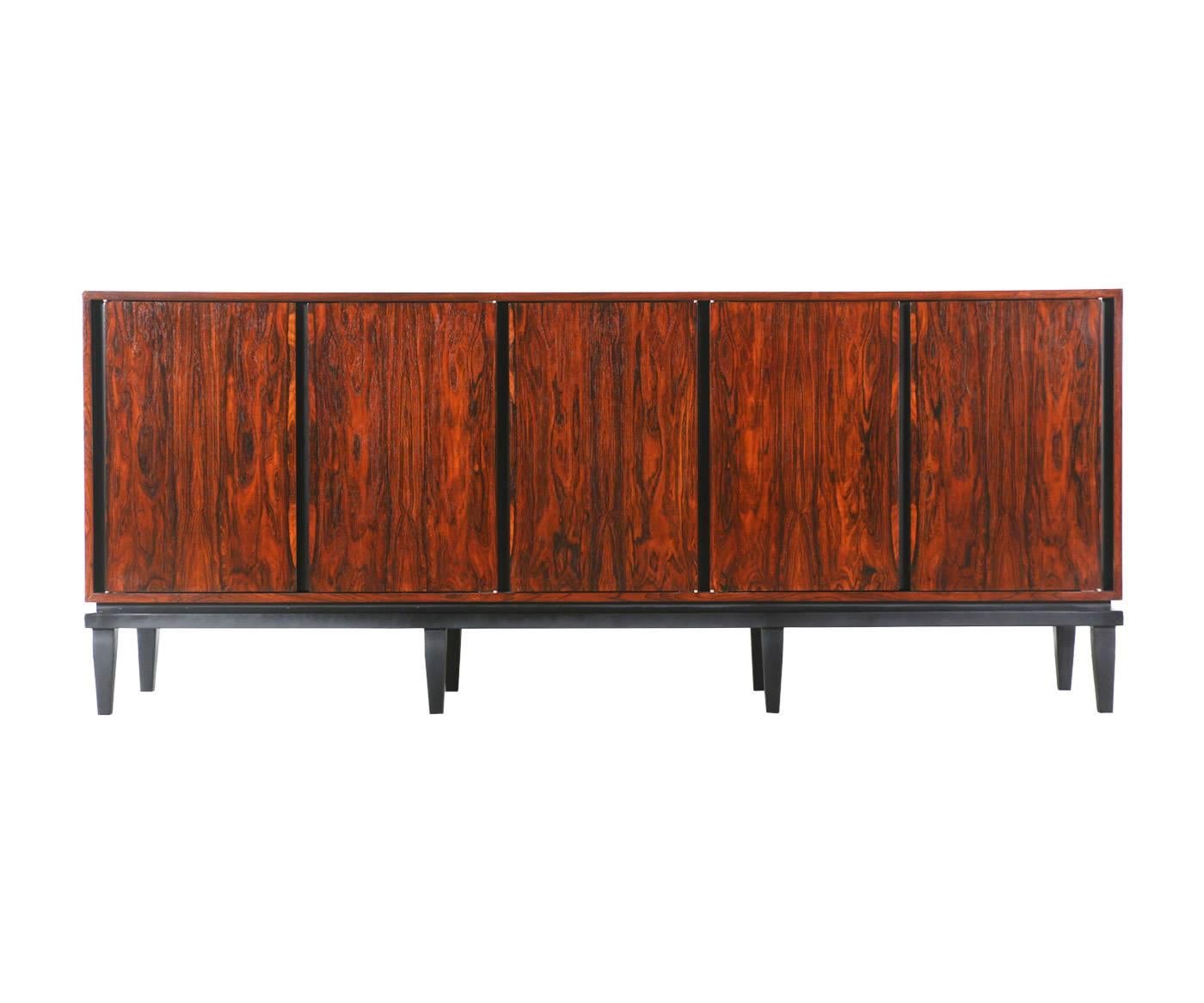 Designer: Unknown
Manufacturer: Unknown
Period/Style: Mid-Century Modern
Country: United States
Date: 1950s

Dimensions: 33?H x 80?L x 18?W
Materials: Rosewood, black satin
Condition: Excellent newly refinished
Number of items: One
ID number: 4627.