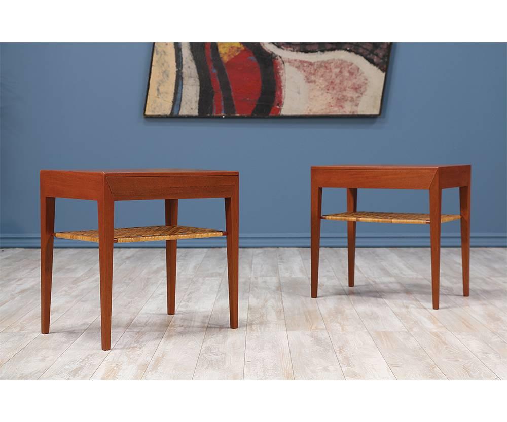 Pair of night-stands designed by Danish furniture designer, Severin Hansen, and manufactured by Haslev Møbelsnedkeri circa 1960’s. Both items maintain their original cane shelf and feature a restored teak wood solid frame with sharp edges and clean