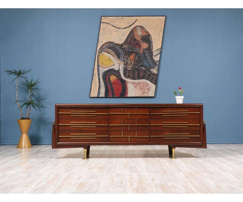 This delicate Dresser, crafted by American interior designer and sculptor, Frank Kyle, illustrates perfectly the perception he had about Modern Design. Designed in the 1950’s, the solid walnut hardware with elegant lines and rich color, create a