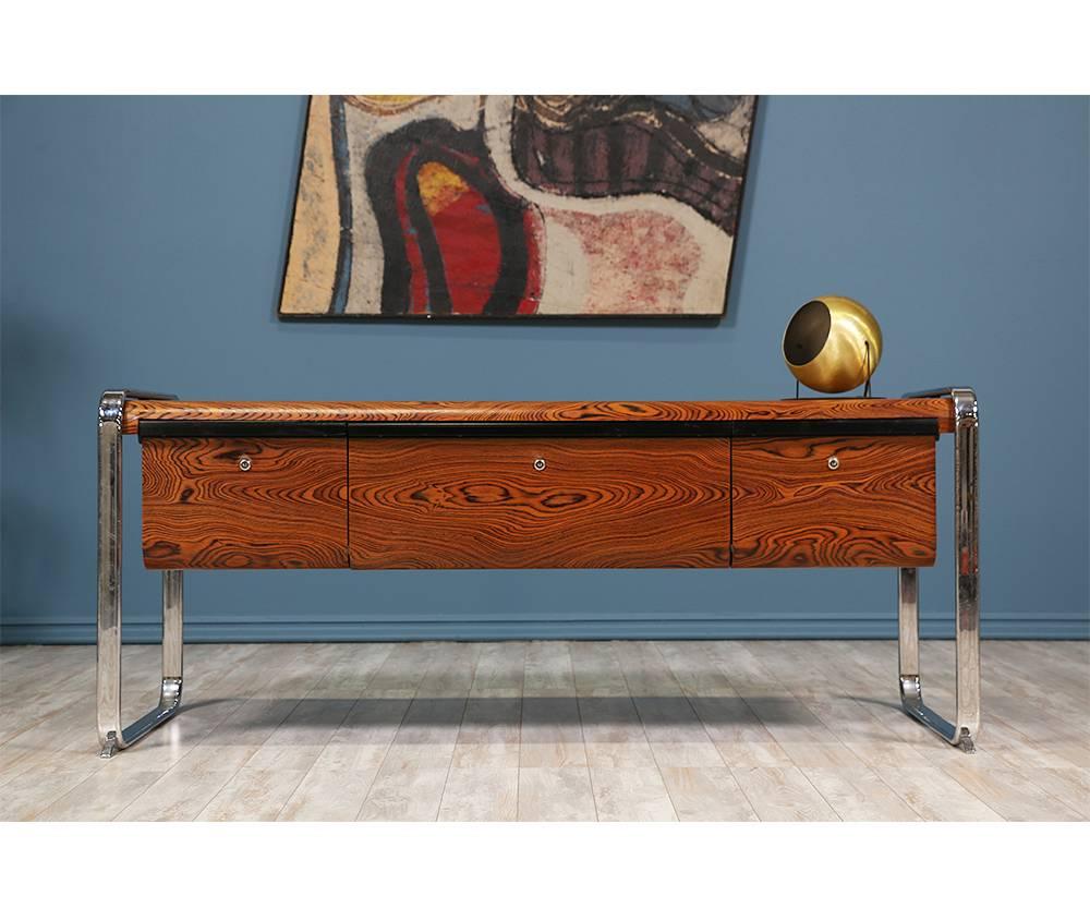 African zebrawood credenza designed by North American industrial designer Peter Protzman for Herman Miller in the 1970’s. This rare piece was part of a minor production due to costs of the materials. Made of exotic African zebra-wood supported by a