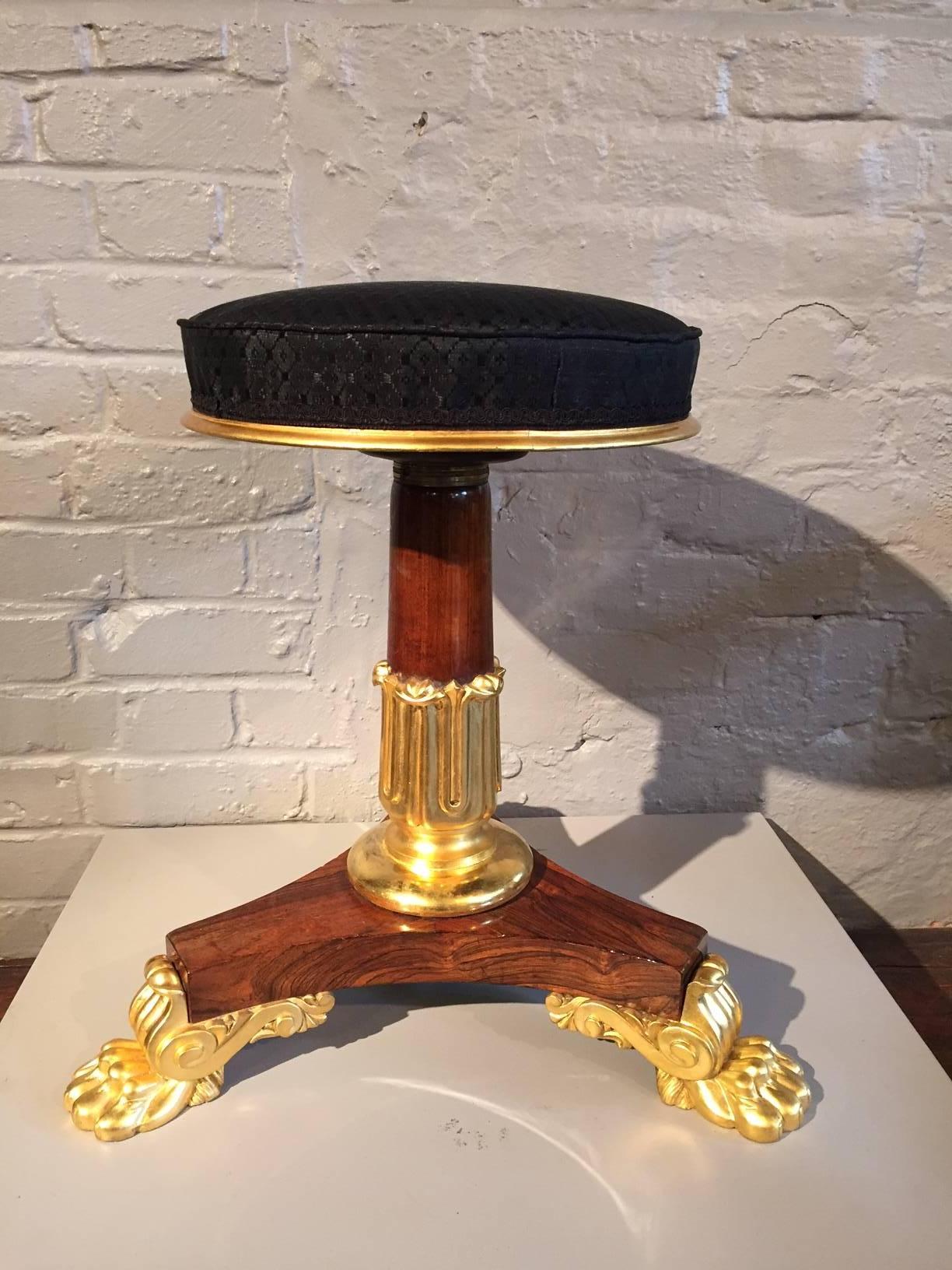 A fine and rare example of Regency furniture attributable to the designs and workshops of George Smith, 1786-1826.
A parcel-gilt adjustable piano music stool in rosewood.