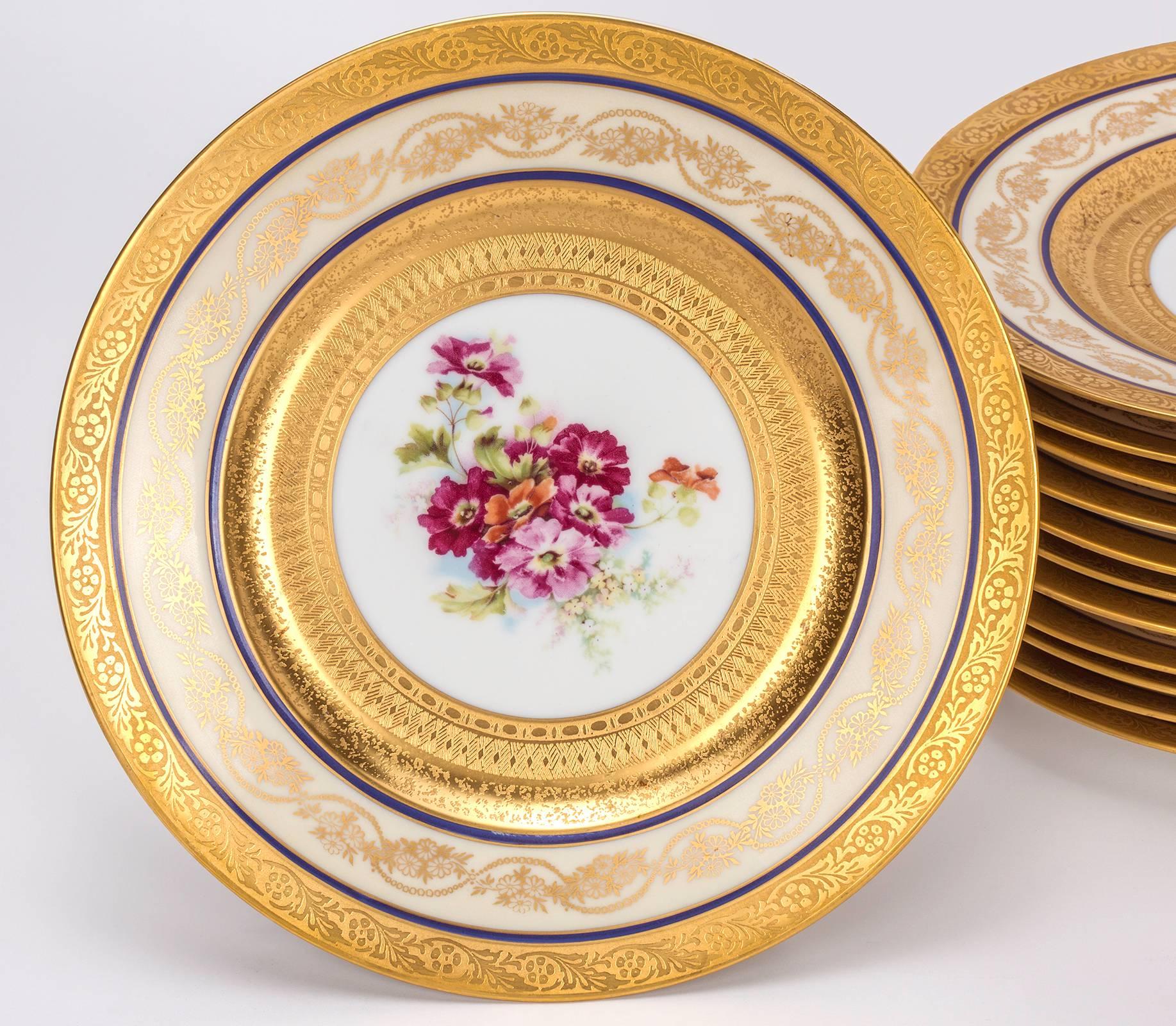 Beautiful set of 12 porcelain dinner plates. Exquisite set in  florals and 24-karat Gold trim. Marked 