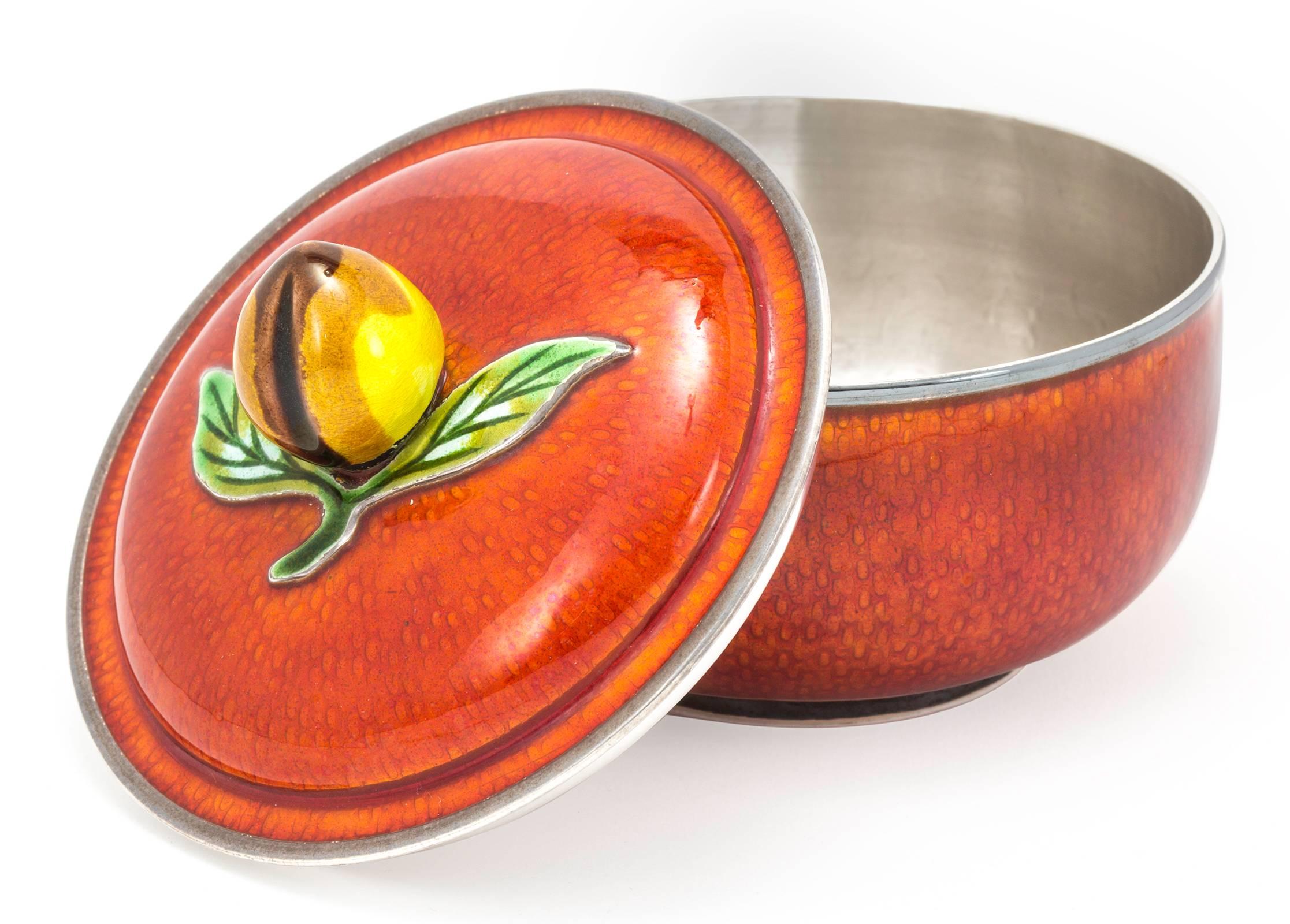 Very finely crafted red enamel round bowl with lid. Top is very decorative with fruit and leaf handle. It is solid 99% pure silver with enamel overlay. In perfect condition.
 