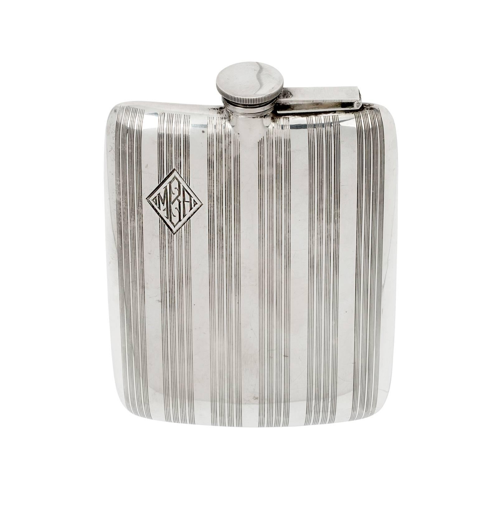 Very handsome rounded rectangular shape sterling silver hip flask. Nice texture designed with etched line stripes. Monogrammed 