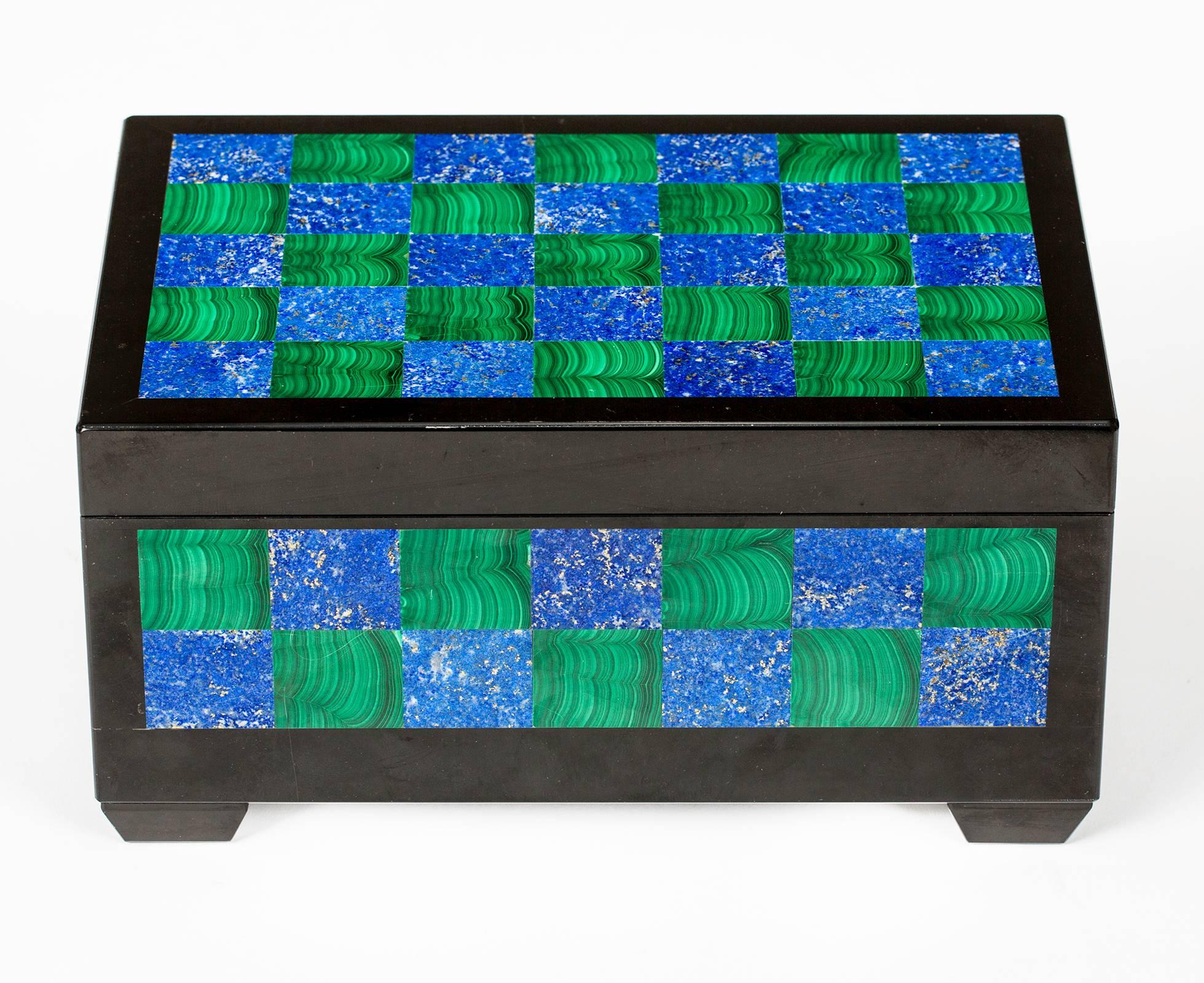 Dramatic and fabulous checkerboard box with hinged lid in malachite and lapis with black onyx liner trim. Interior is wood lined. Raised feet in onyx. Most beautiful box for your desk. In excellent condition.