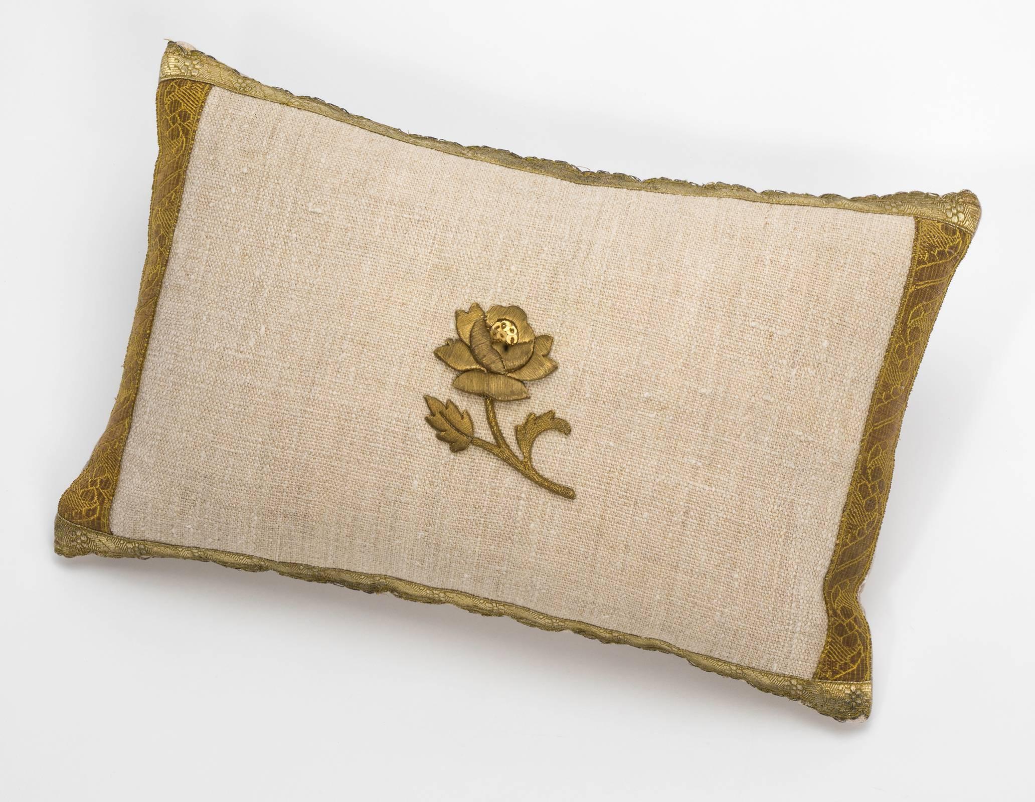 Newly made, vintage linen pillow with 19th century metallic gold thread rose appliqué. Bordered with antique gold trims. Plain linen back. Filled with new feather down insert.
