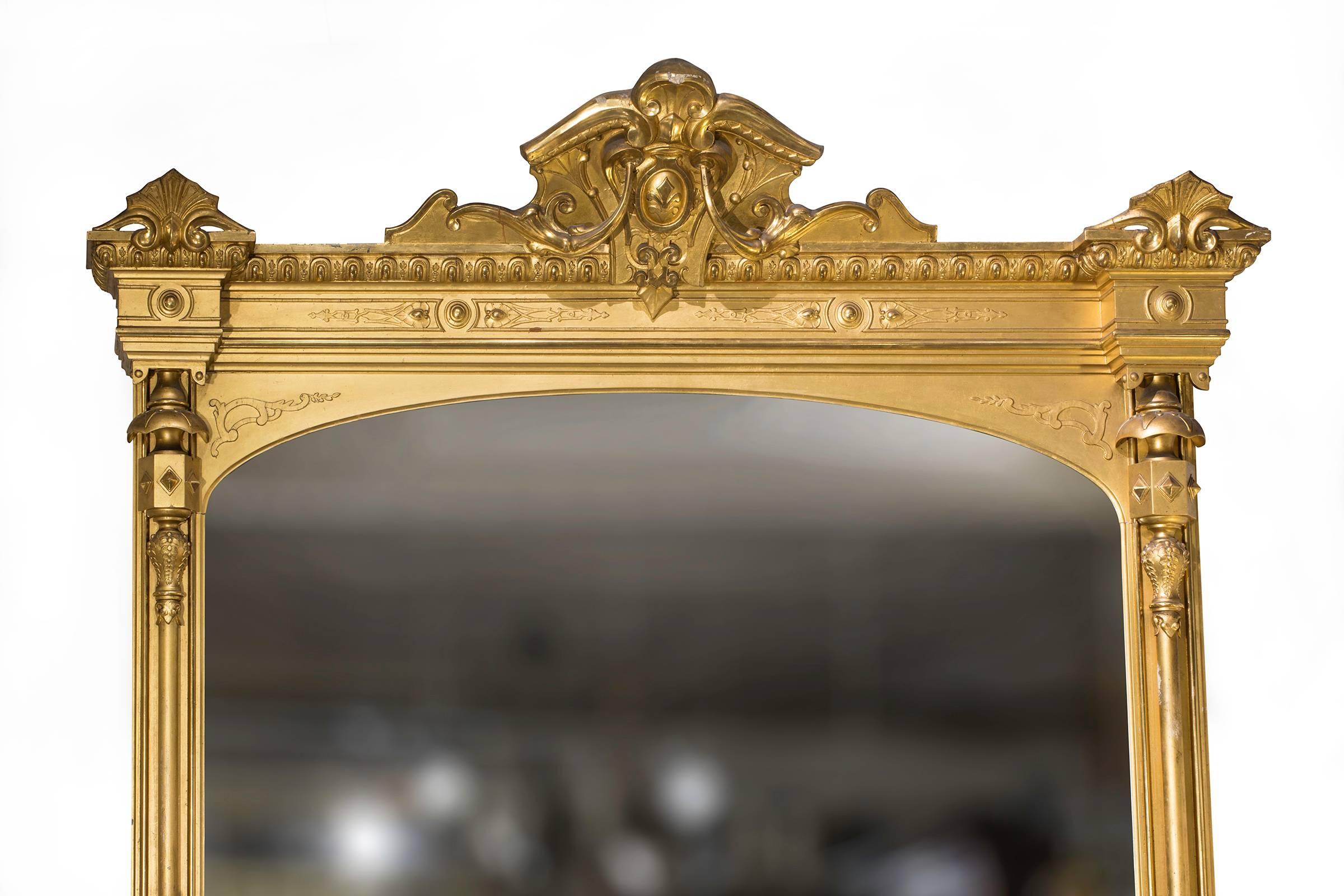 Magnificent 19th century large scale mantel mirror. Wood carved and gilded in 24-karat gold and diamond dust mirror, giving the extra sparkle. Originally graced as a over mantel mirror in a very fine estate in San Francisco.