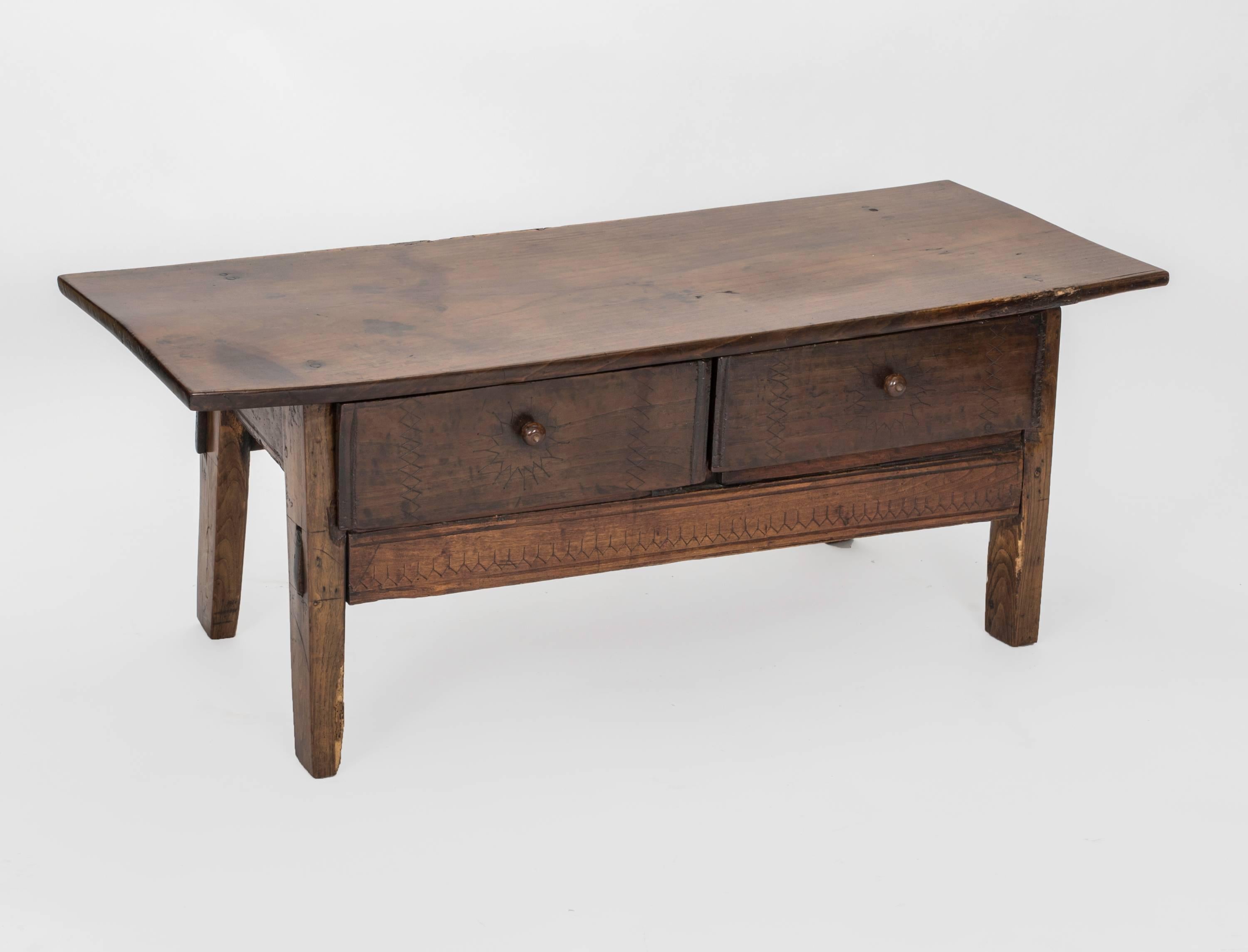 Beautifully aged 19th century French walnut cocktail table.
Two useful drawers with round wooden pulls, straight simple legs give a modern look.
  