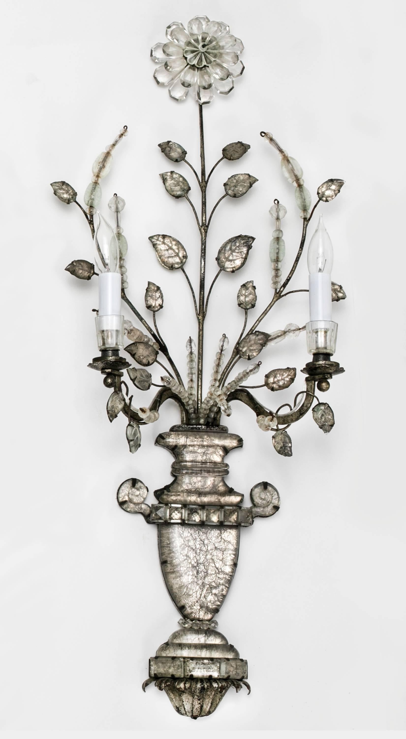 Antique French Maison Baguès, beautiful set of four wall light sconces, circa 1880s. Carved crystal glass vase with floral leaves in shimmering silver gilt. 
Each sconces have two candle lights. New electric wireing, ready for installation.