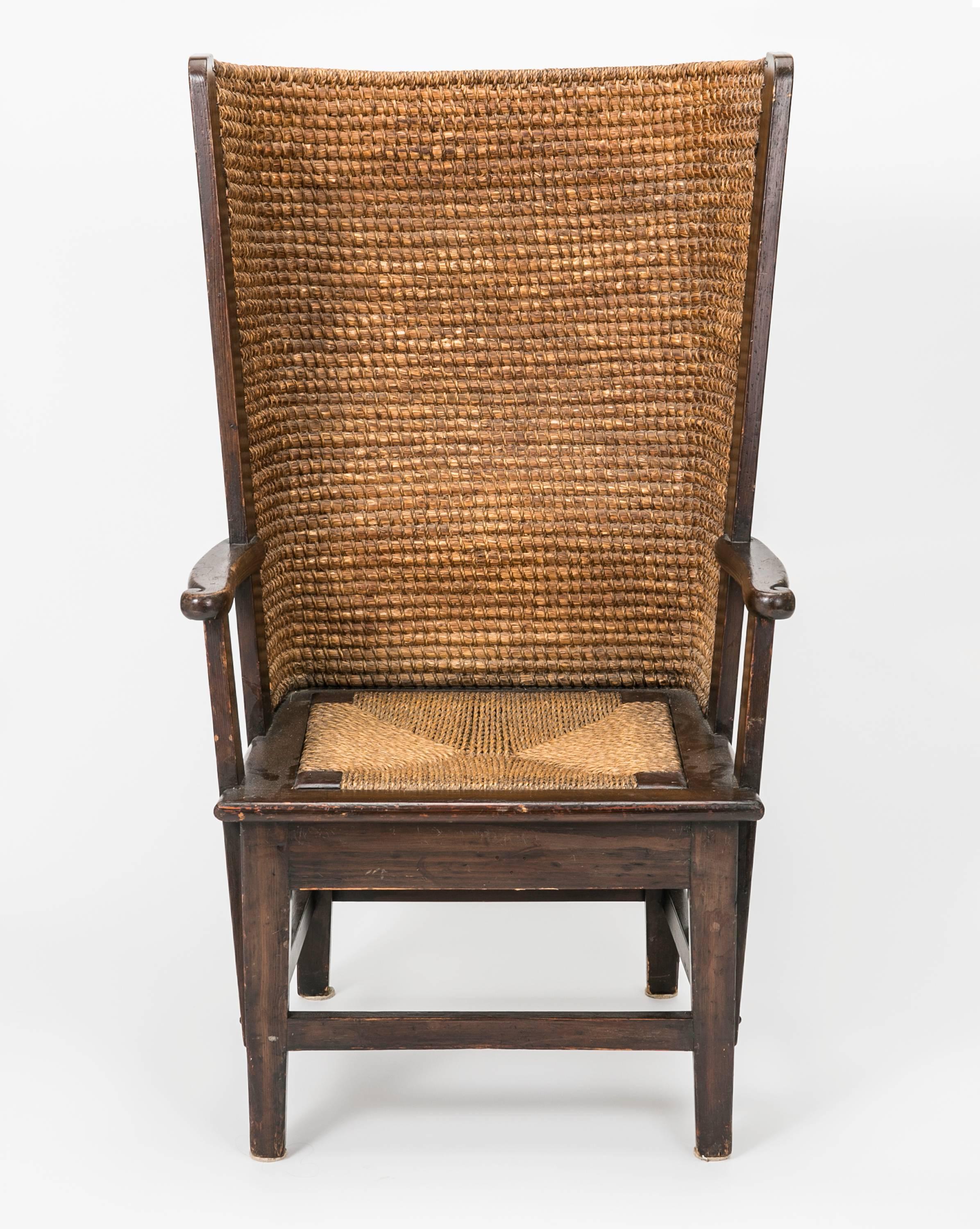 Scottish Orkney rush chair, circa 1920. Very charming barrel shape in handwoven grass rush, framed in carved oakwood. Seat is also rush. Seat cushion would make it very comfortable.