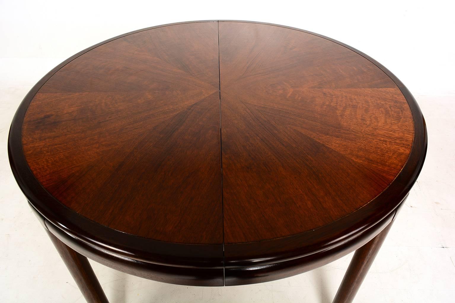 For your consideration a beautiful oval or round dining table with one extension. Solid mahogany wood frame with walnut plywood in the center. 

Legs are numbered and can be removed for safe and easy shipping. 

No label present from the maker.