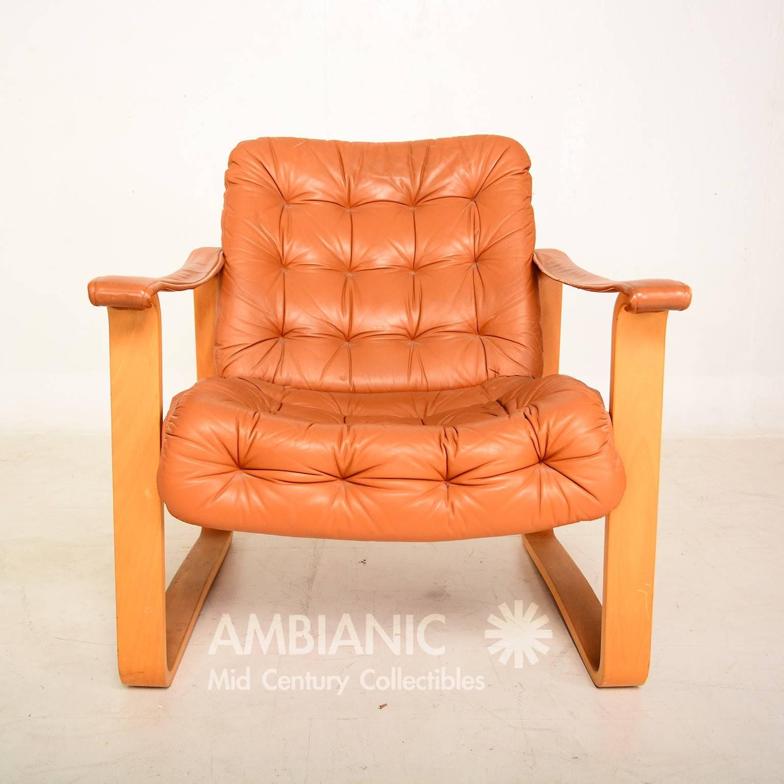 Mid-Century Danish modern armchair made in Finland. 

Original label present.

Maker: BD Furniture.

Hounekalutehdas-mobelfabrik.

 OY BJ. Dahlqvist AB, Finland.

Box 29\68601 Jakobstad-Finland.

Leather cushions with matching armrest in
