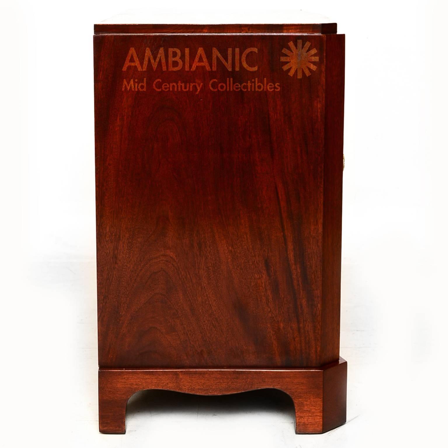 Art Deco walnut cabinet with bronze pulls.
Click in our AMBIANIC logo to view all our inventory. 

USA, circa 1950s, unmarked. No info on the maker.
Measures: 30 1/4