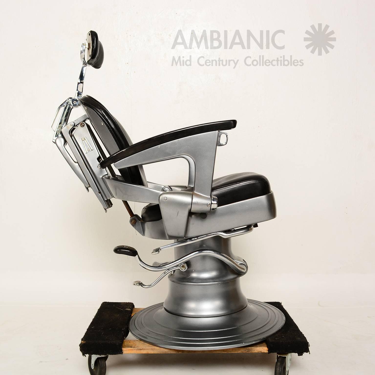 For your consideration a vintage barber chair manufactured in the USA by Ritter.
The precision and quality used to built this chair is just amazing. 
The hydraulic system works in perfect order. The cushions are upholstered in black leather with