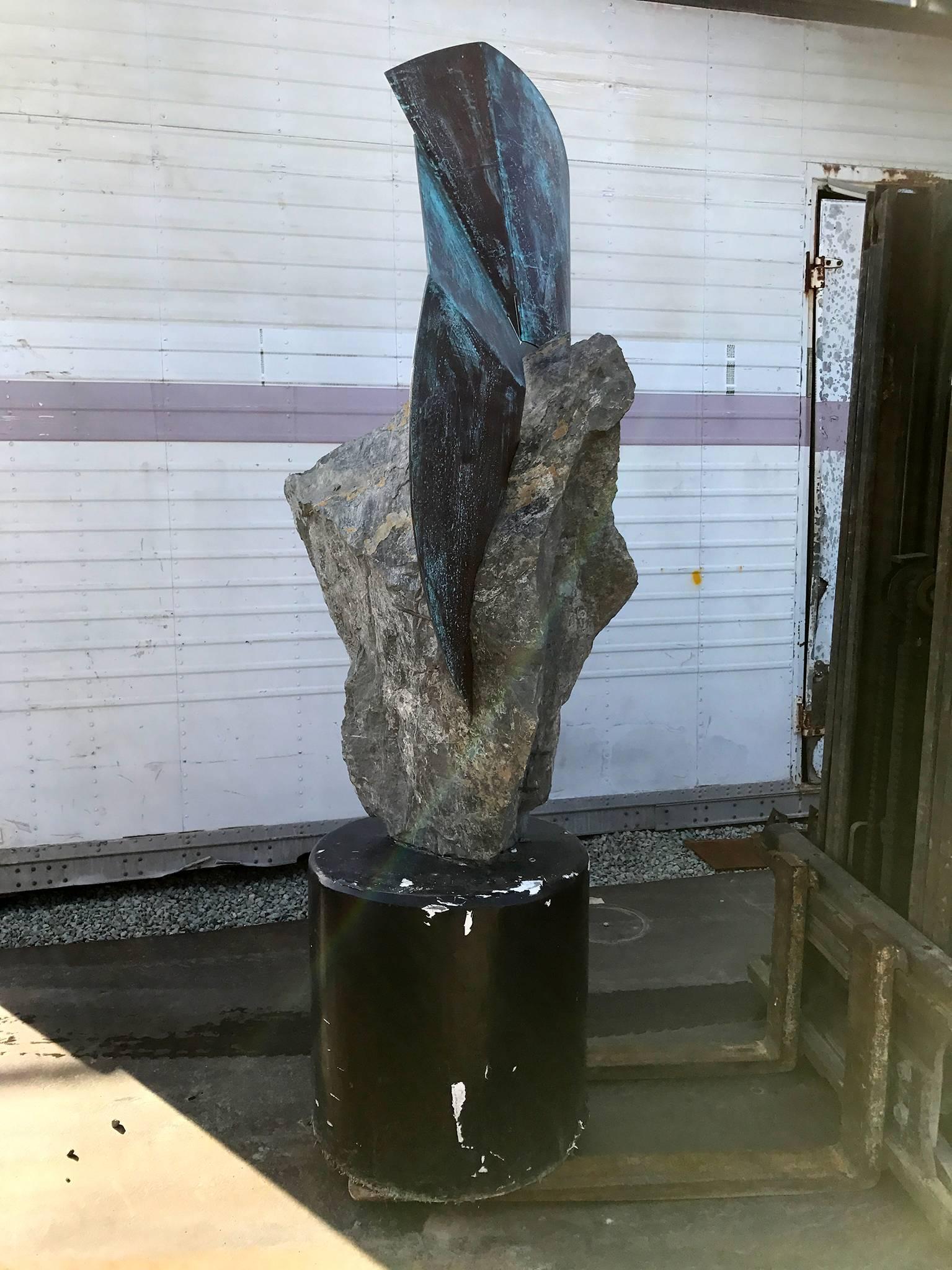 For your consideration a contemporary sculpture over 7' tall. 

Stone mounted with a cement base (painted in black) and upper section in patinated copper. 

Beautiful abstract or contemporary look. 

No information from the maker. Sculpture