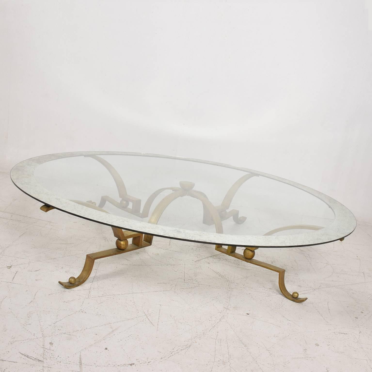 For your consideration a cocktail table by Arturo Pani.
Beautiful and unique design in solid brass. Large glass top (60" in diameter) has an antique mirror band (about 3")
Original patina.
Mexico, circa 1950s
Dimensions: 60"