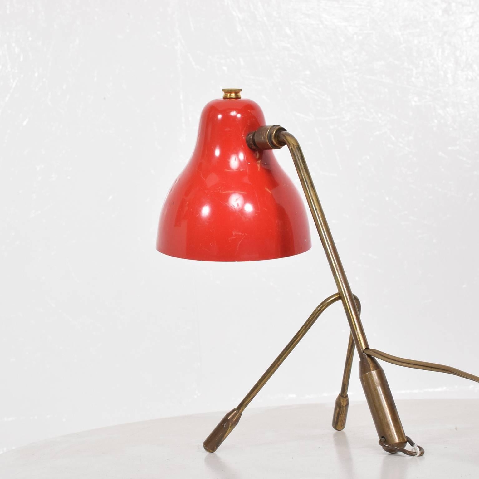We are pleased to offer for your consideration a vintage table lamp. Made in Italy, circa 1960s. Aluminium shade in red color with brass body with original vintage patina.

Unmarked. Gently used. Original vintage condition. Rewired.