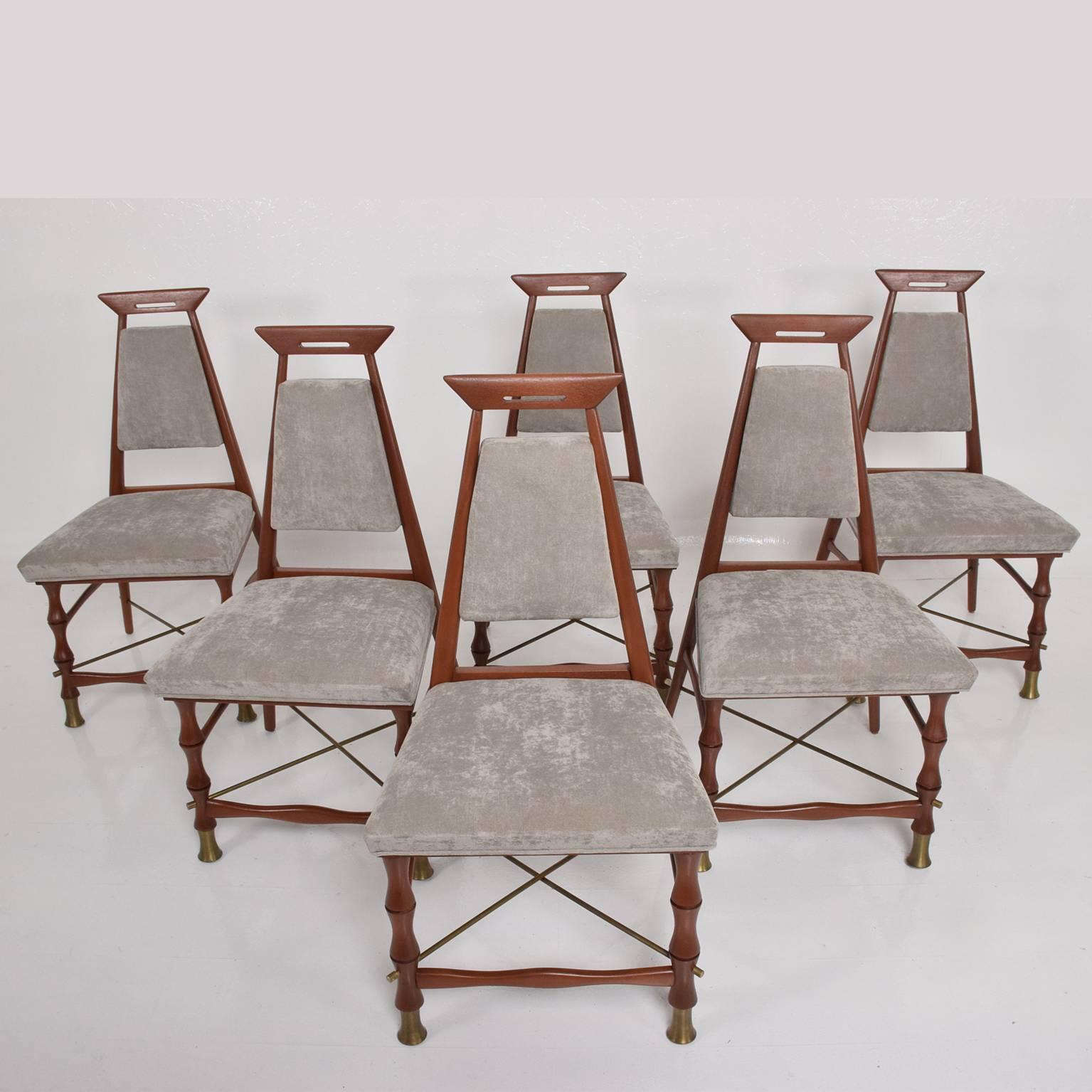 For your consideration a set of six (6) dining chairs. Sculptural shape. custom-made. Solid mahogany frame with brass hardware. Grey upholstery in good condition. 

Unmarked, no label present from the maker. Mexico, circa late 1950s.