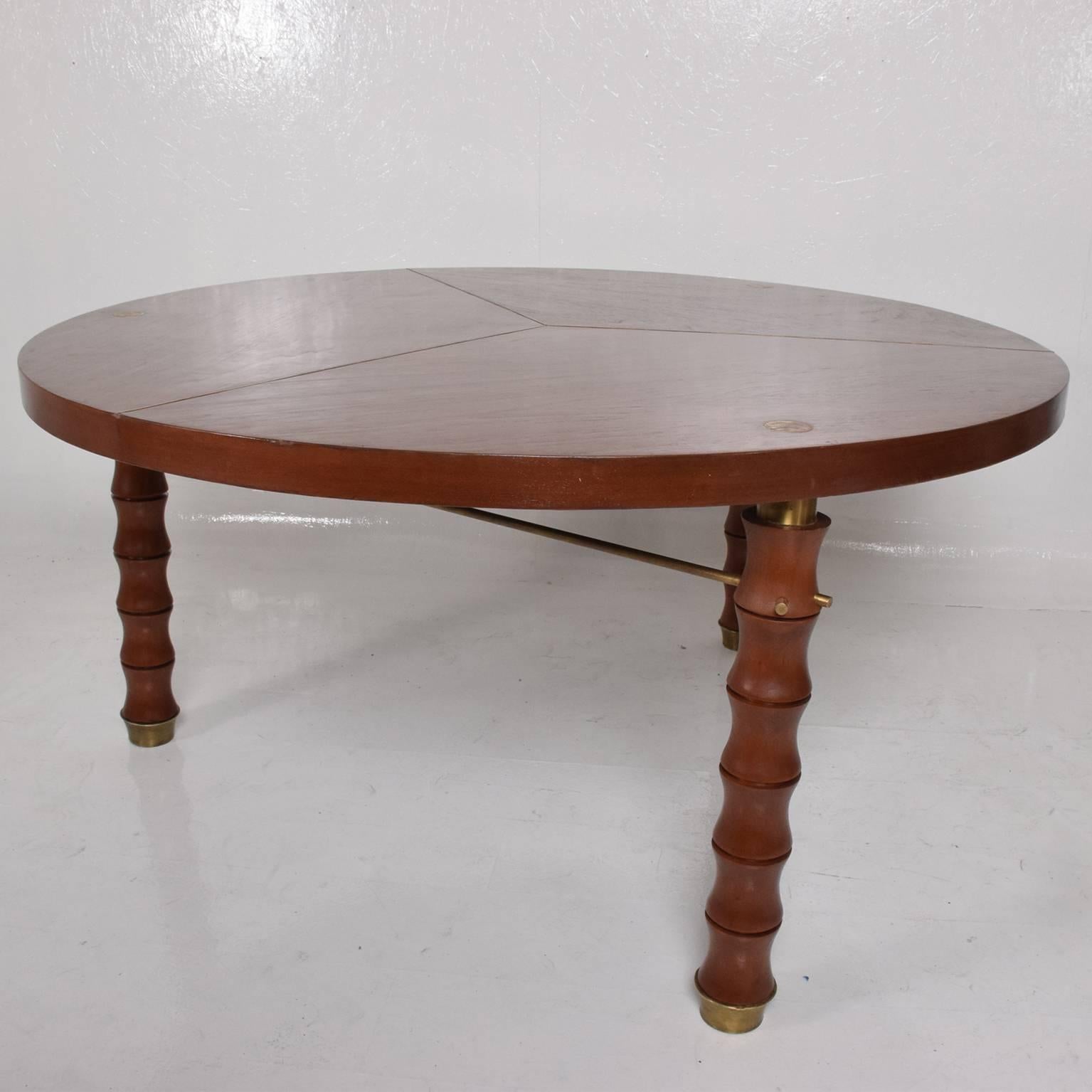 We are pleased to offer for your consideration a beautiful round dining table. Attributed to Frank Kyle, custom work, Mexico City circa 1960s.

Mahogany wood with brass accents. 
Unmarked, no label or signature present. Price per table