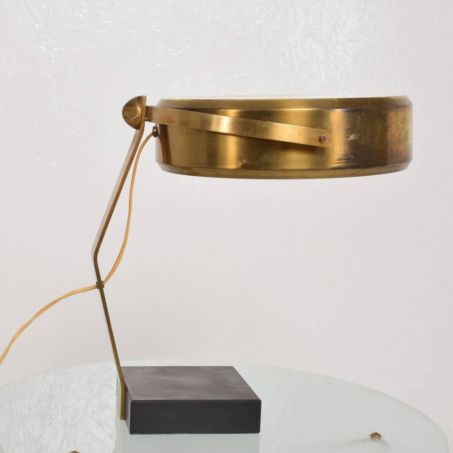 We are please to offer for your consideration a beautiful sculptural table lamp in brass with glass diffuser. Made in Italy, circa 1960s.

Lamp requires two E-14 bulbs (not included). 

Dimensions: 15 1/2" H x 15" D x 14" W.
