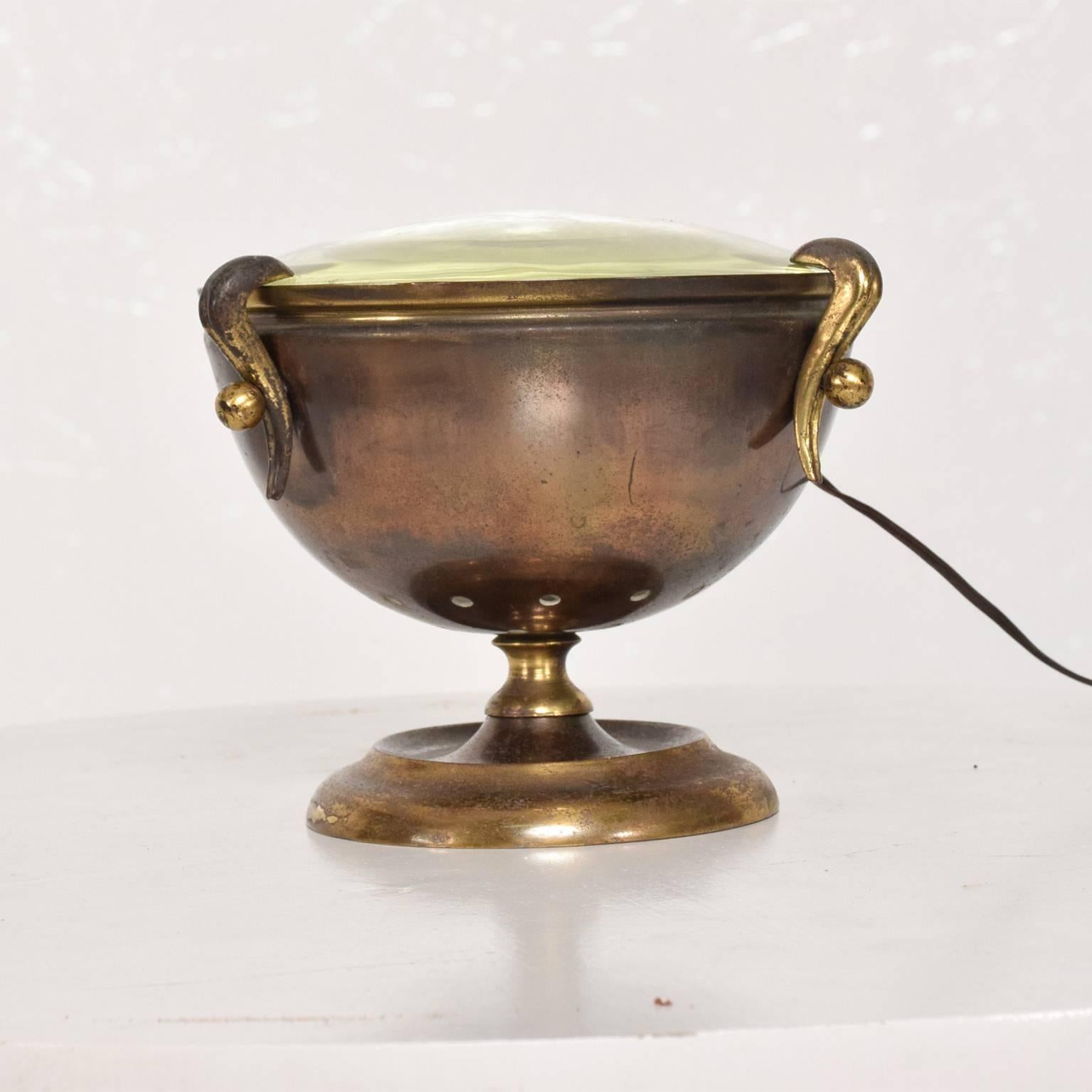 For your consideration a brass table in the shape of an urn.
Magnifying glass top.
Rewired. No information on the maker. No label present. Italy, circa 1950s.
Dimensions: 4 1/2