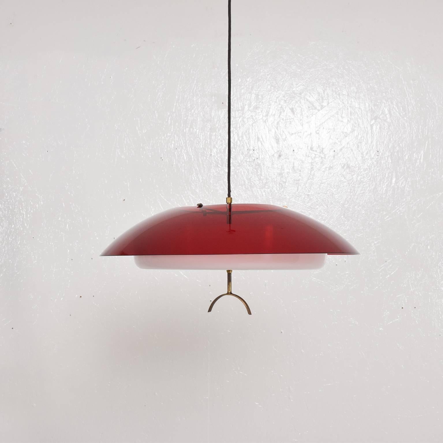 A beautiful sculptural pendant light fixture by Stilux.  Made in Italy circa 1960s. 
Two tone moulded plexiglass in white and translucent red color with patinated brass hardware. 
It requires three 3 e-14 bulbs. 

Dimensions: 6" H. 20" in