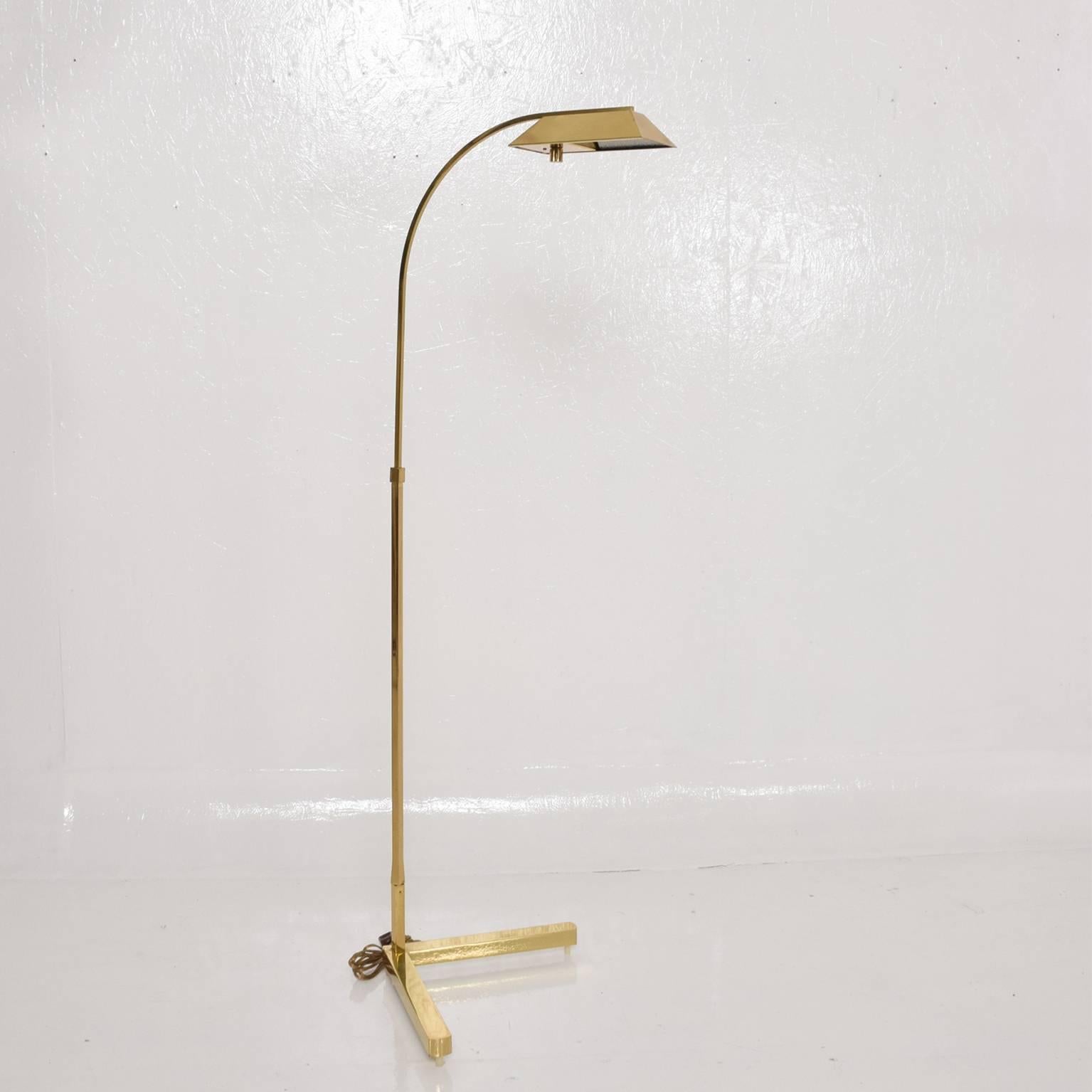We are pleased to offer for your consideration a Mid-Century Modern brass floor lamp by Casella.

Lamp retains label from the maker underneath. 
Dimensions: 49" H x 17" D x 12" x 12" base.