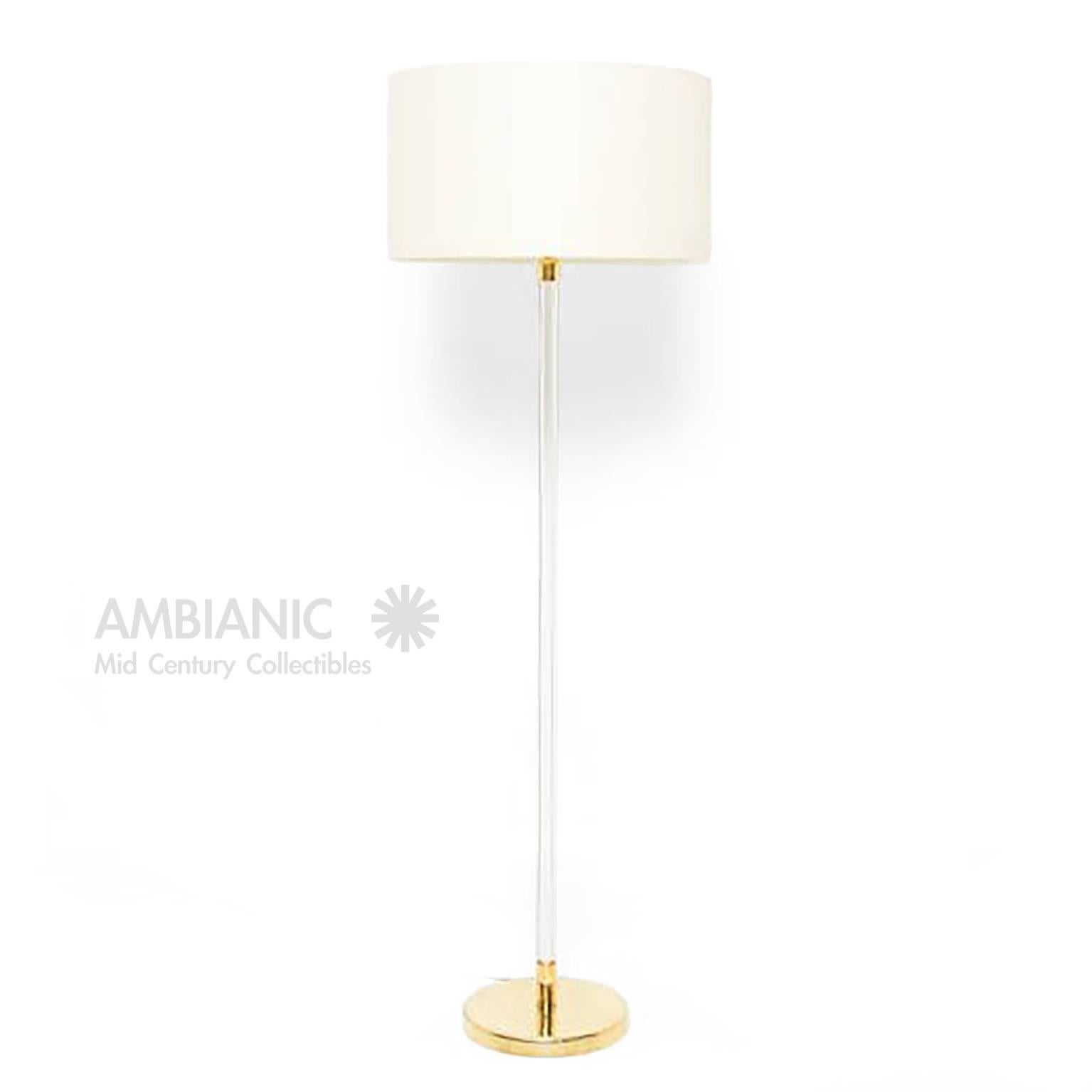 We are pleased to offer for your consideration a floor lamp made of Lucite and brass. 
Beautiful clean modern lines. 

Amazing design where electric cable can not be seen in the Lucite. 
Shade not included. For prop only. 

Dimensions: Lucite is