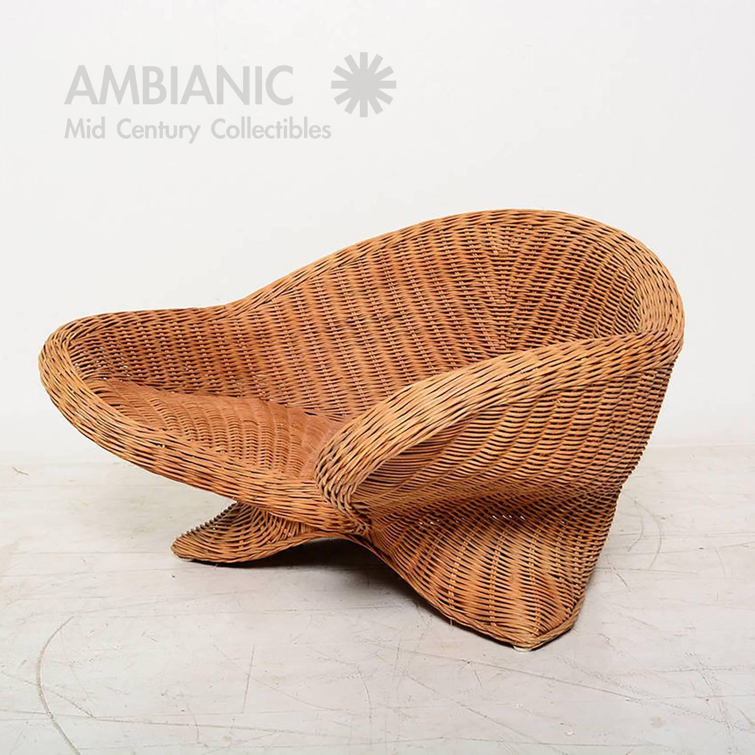 For your consideration a low armchair made of wicker. Rare and hard to find. 

Beautiful sculptural shape.

Unmarked. 

31 X 26" X x 18 1/2" H , Seat 6" H 

 