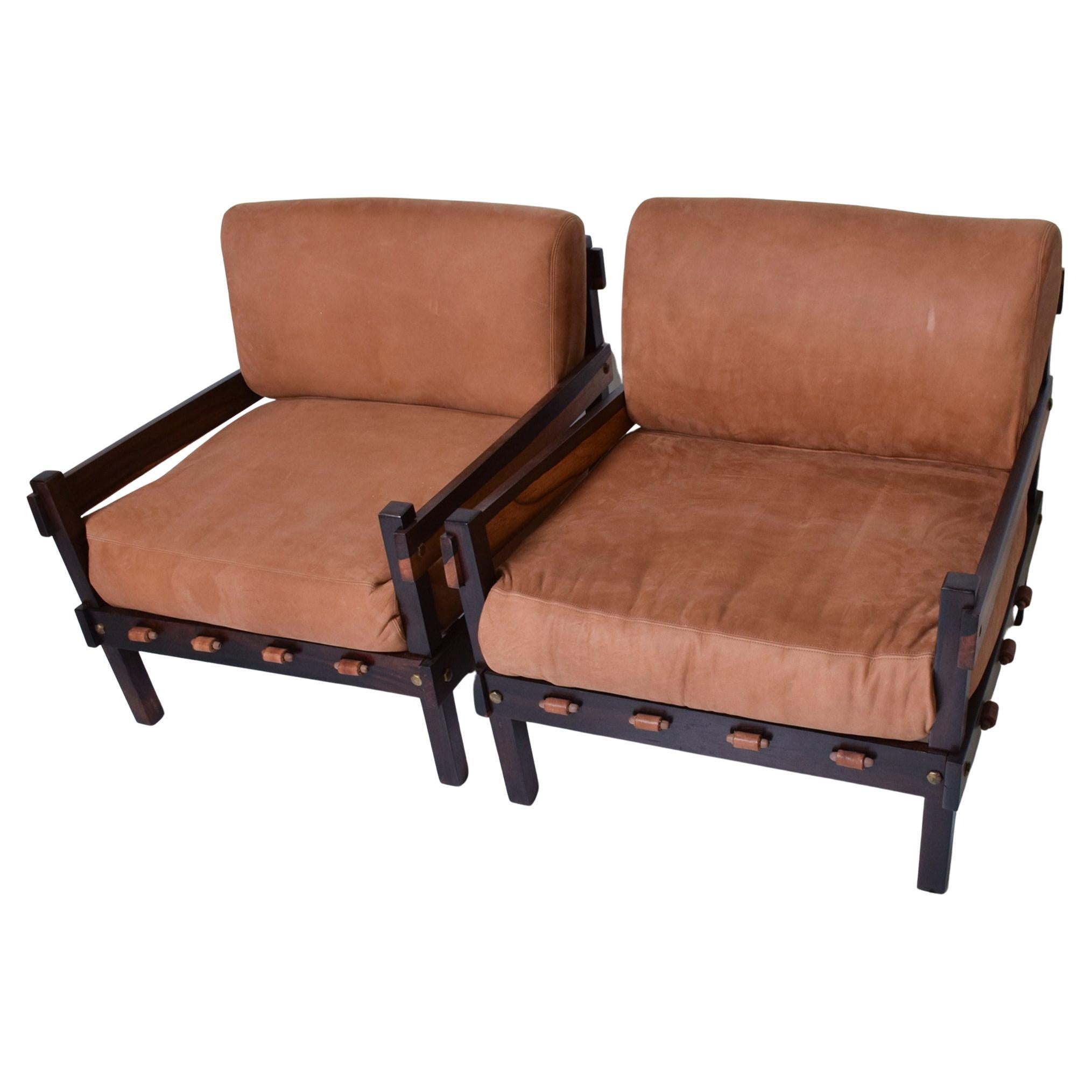 Pair of Brazilian Rosewood Lounge Club Easy Armchairs circa 1960s Sao Paulo
Solid Brazilian Rosewood with Brass accents. New Leather Cushions.
One chair retains original label.
Attribution Sergio Rodrigues, father of midcentury modern Brazilian