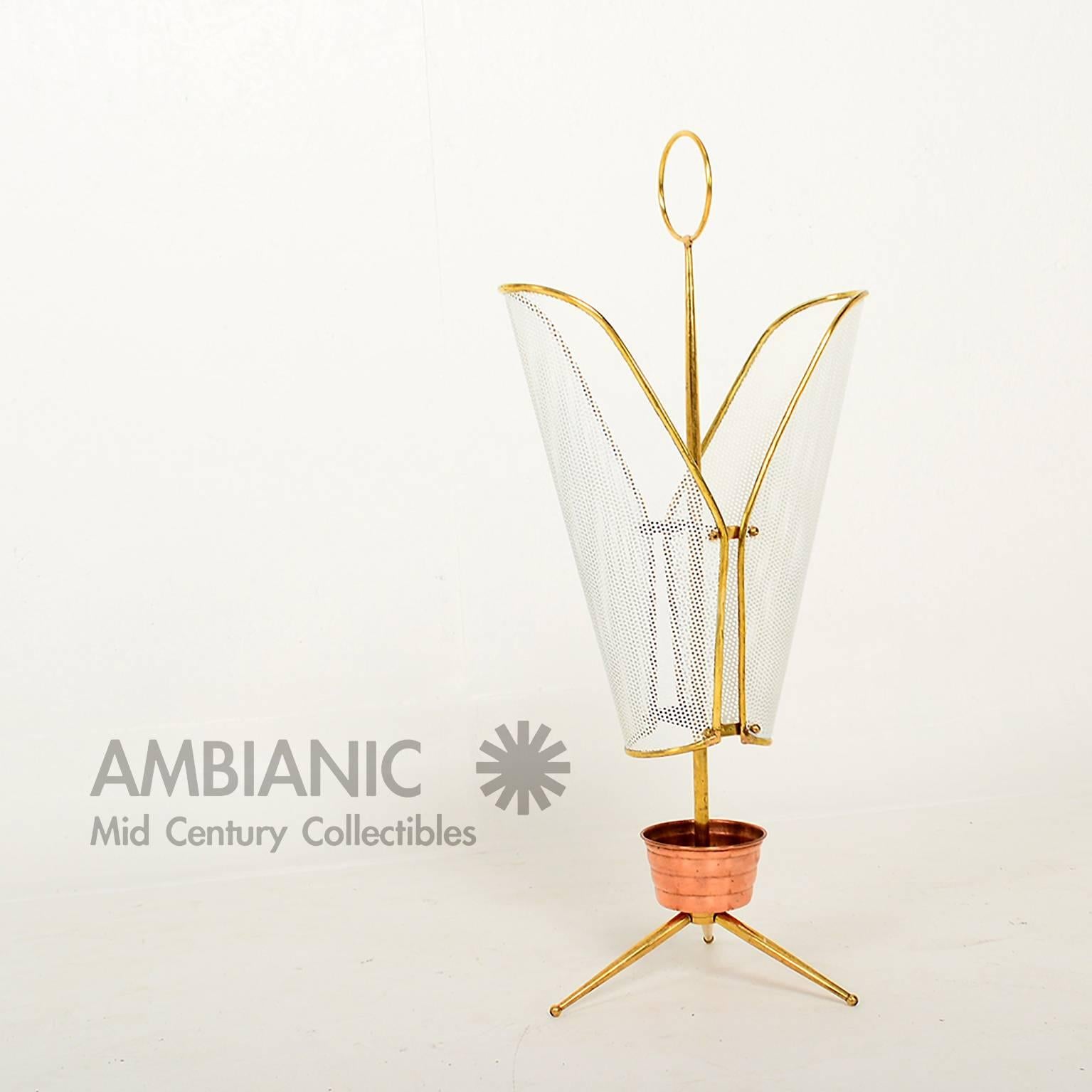 For your consideration mid century modern Italian umbrella holder.
Design after Mathieu Mategot with perforated metal , brass and copper. 

Constructed with perforated metal painted in white. Solid brass frame and copper holder.

DIMENSIONS
27
