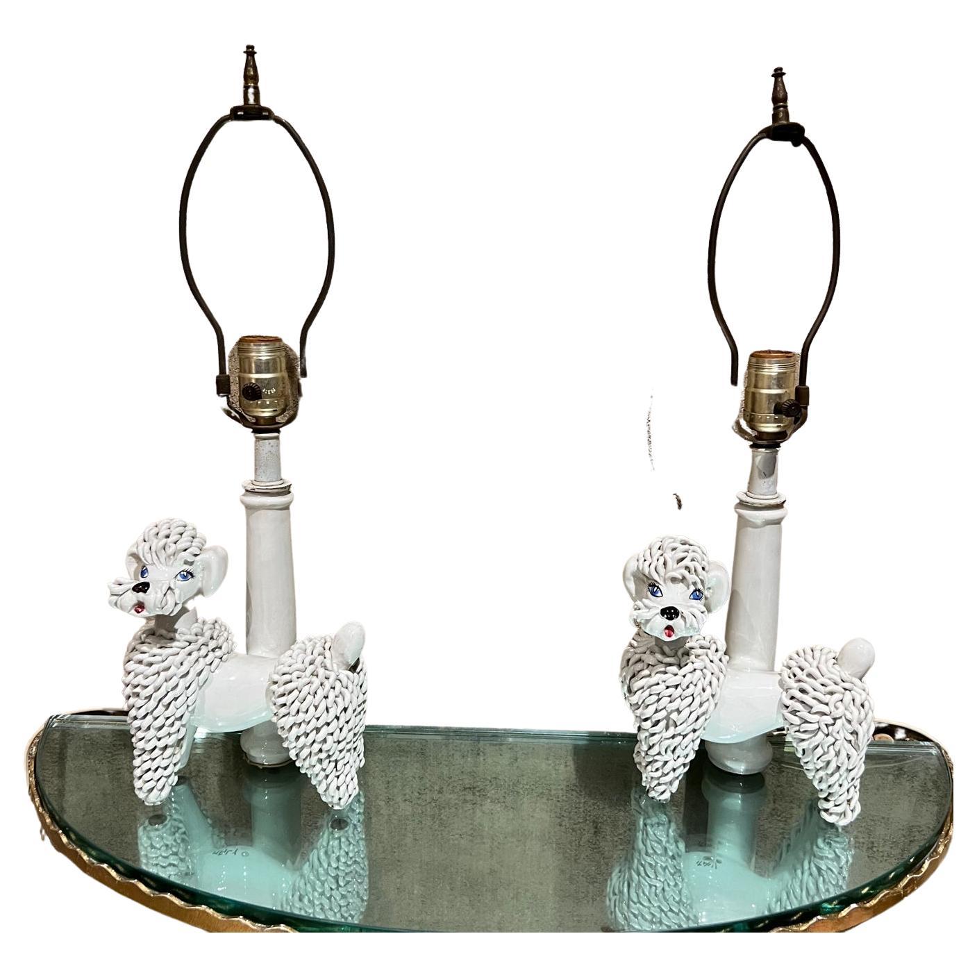 1950s table lamps Doggy from Italy
Style of Phyliss Morris Hollywood Regency Era
13 to socket 20.5 to finial x 7 w x 4 D
Pair of table lamps made in Italy, Poodle dogs with blue eyes.
Absolutely adorable!
No shade is included.
Lamps only.
Preowned