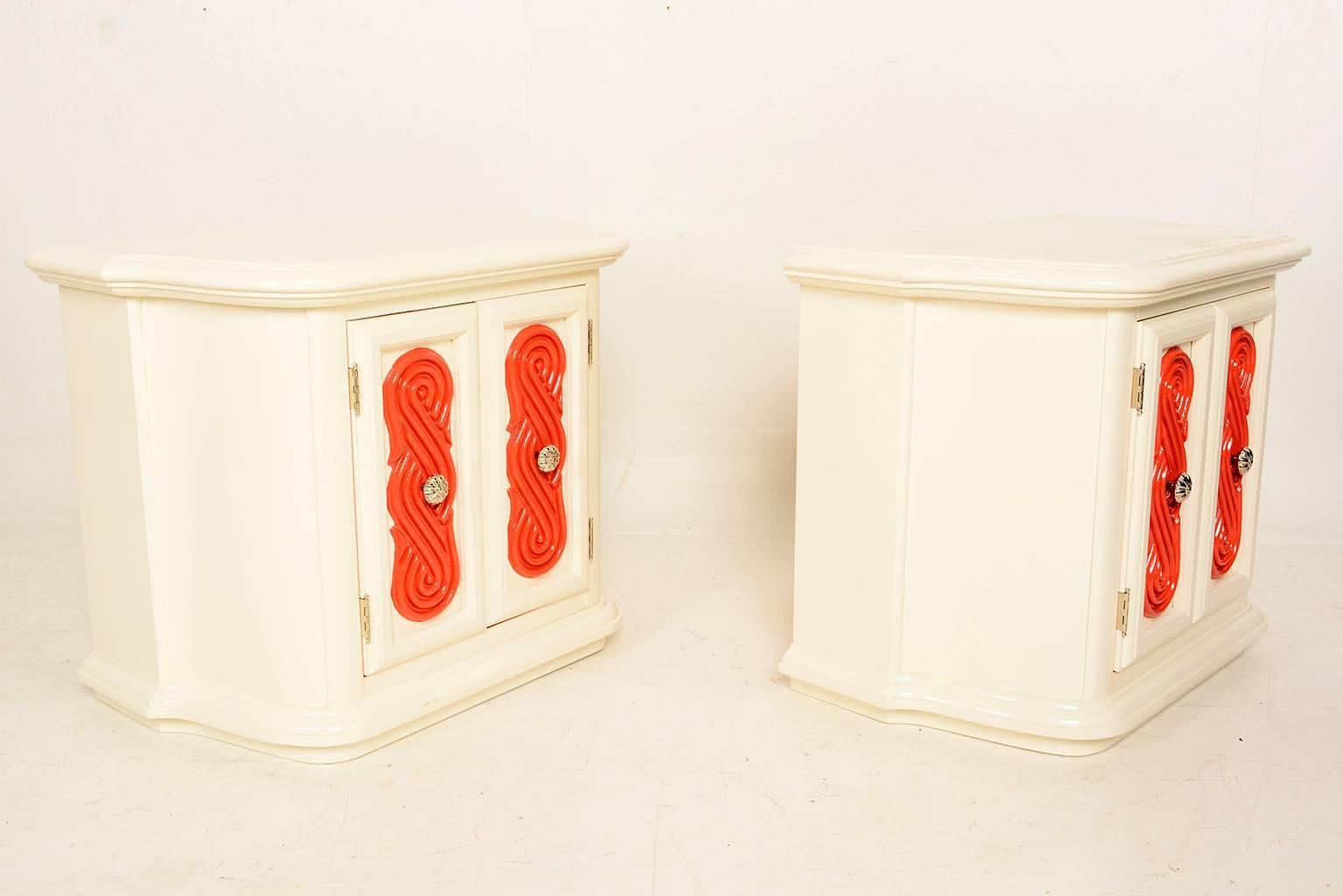 For your consideration a pair of Hollywood Regency nightstands.

Finished in lacquer (ivory and orange) with polished nickel hardware. 

The interior is finished in orange with a shelf (non adjustable.)

Both nightstands have been restored and