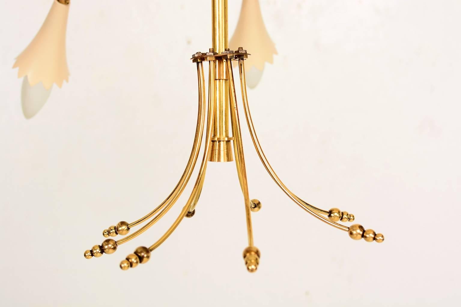 For your consideration a beautiful Italian chandelier constructed with brass and aluminum shades. 

Eight arms decorated with solid brass leaves accents, resembling a brach with a flower. 

Chandelier has been rewired and it is in excellent