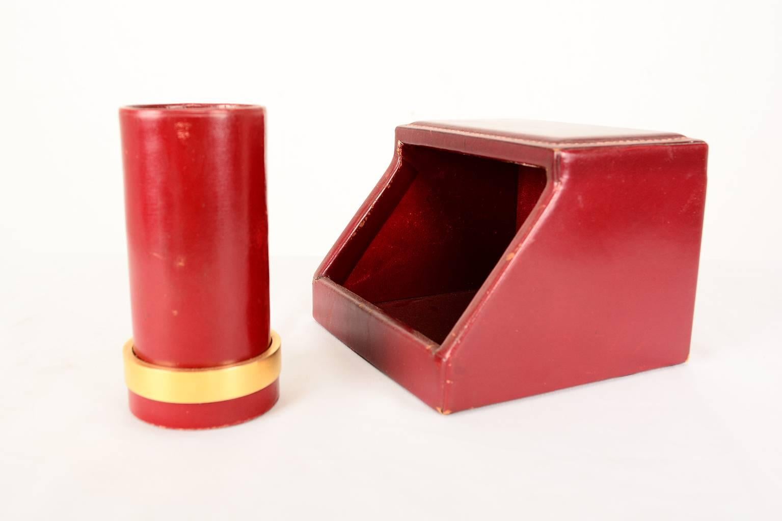 For your consideration a beautiful vintage desk set made by Hermes. 
Fine quality leather work with iconic precise stitching in burgundy leather. 

Note holder and pen holder. Both pieces stamped underneath.

Expect gentle vintage wear. 

Pen