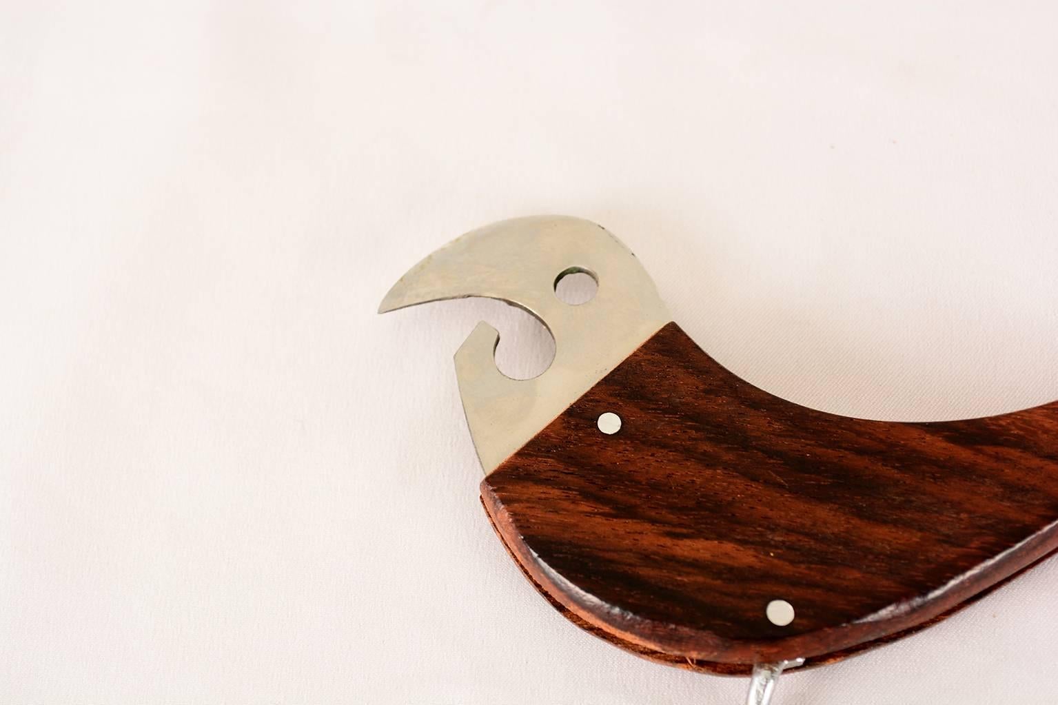 For your consideration a beautiful bird bottle opener in stainless steel and rosewood,
1960s.