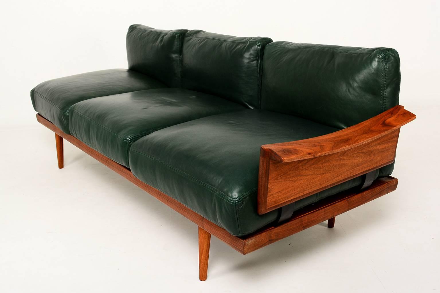 For your consideration a vintage Scandinavian sofa set fully restored in excellent condition.

Exotic rosewood frame with some teak sections. New forest green leather cushions. Filled with feather down/mix foam. Very comfortable. 

Sculptural