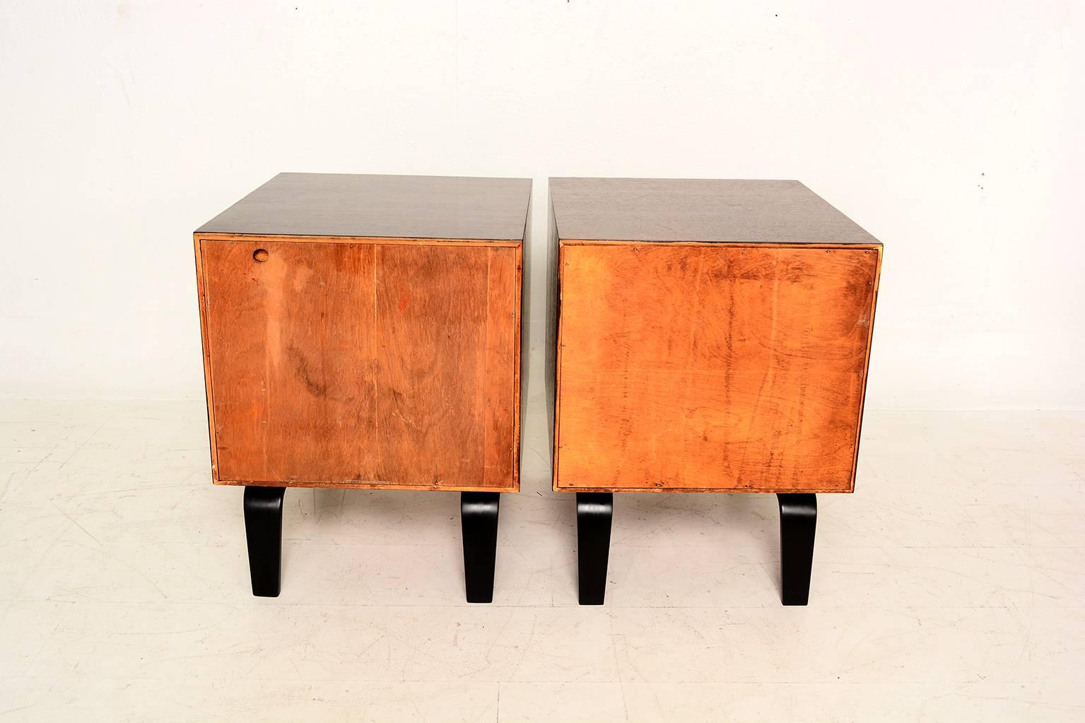 For your consideration a pair of Mid-Century Modern nightstands.
Sculptural legs and handles. 
Double dove tail joints. 
Designed by Clifford Pascoe, USA, circa 1950s.

 