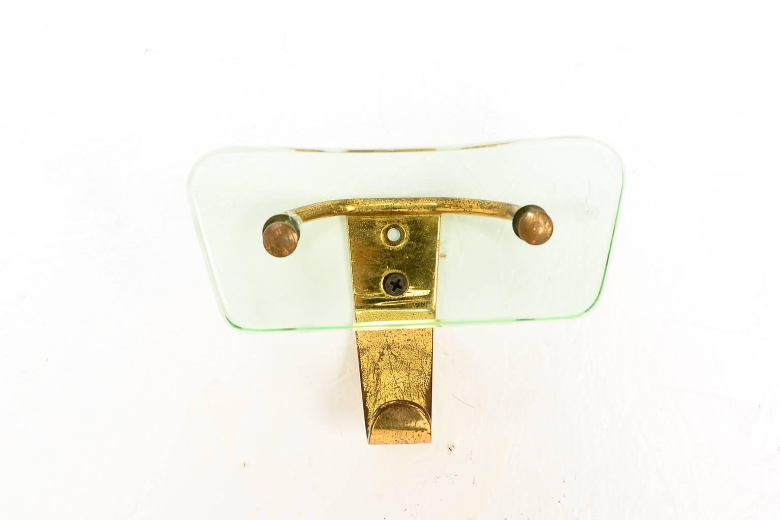 For your consideration, a beautiful single 1950s glass and brass coatrack attributed to Fontana Arte.
Italy, 1950s.

