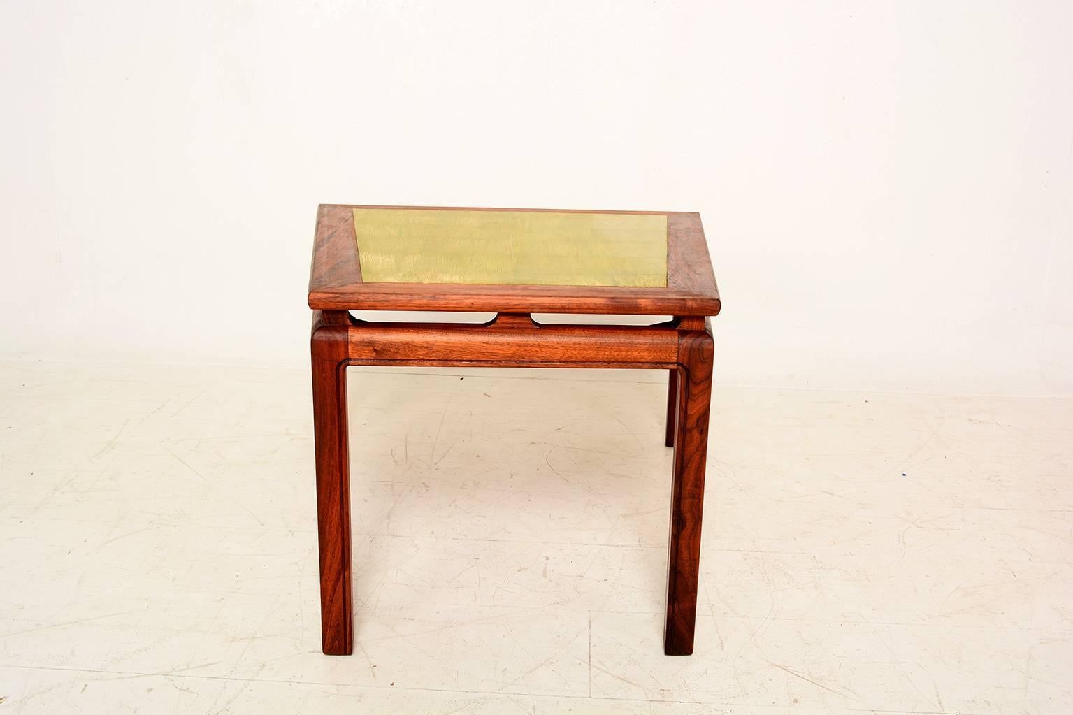 For your consideration a beautiful Mid-Century table constructed with walnut wood and gold leaf top.

Table construction is very good. No label present from the maker.