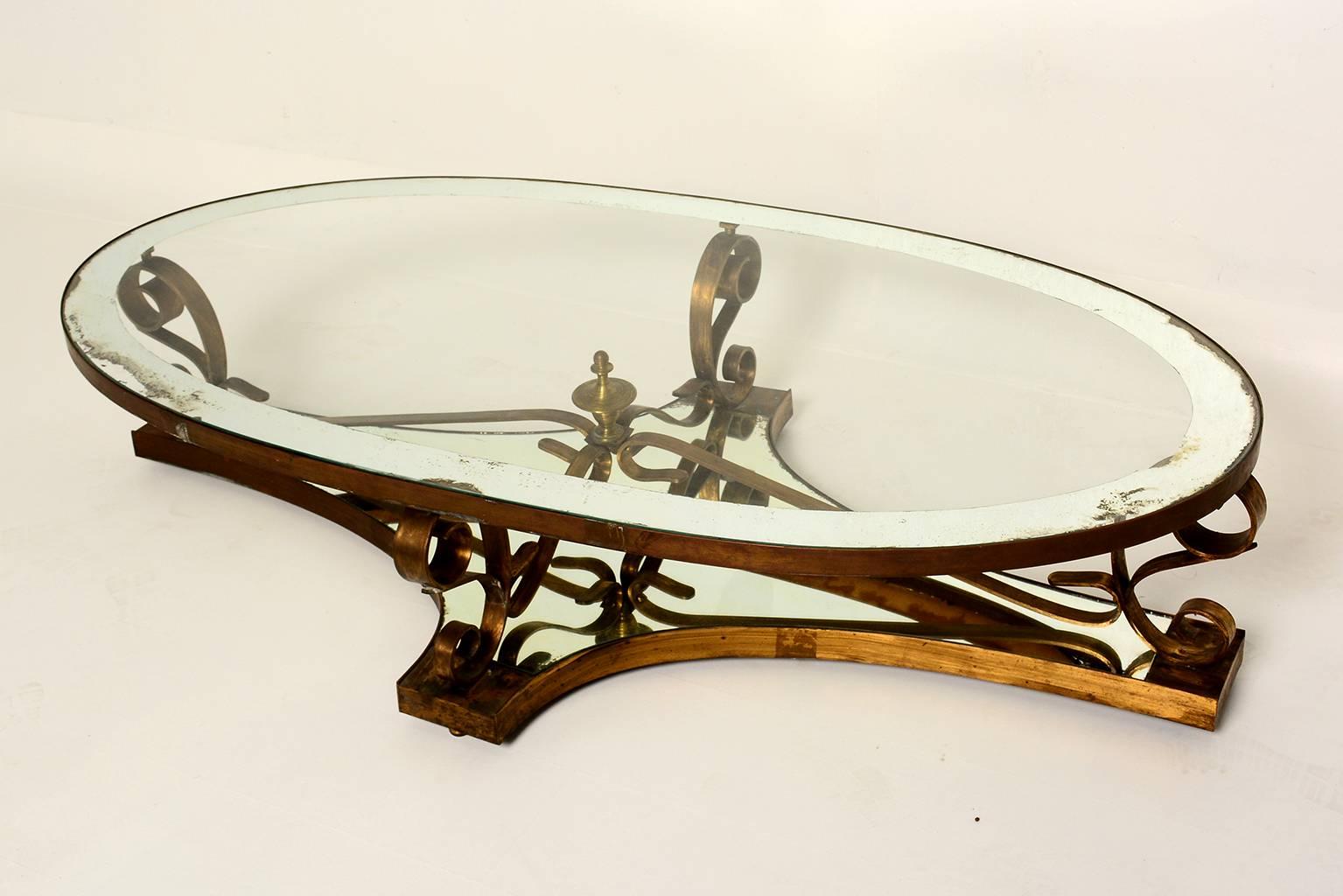 For your consideration a beautiful coffee/cocktail table by Arturo Pani.
Sculptural shape with solid brass. Original glass top with mirror band.