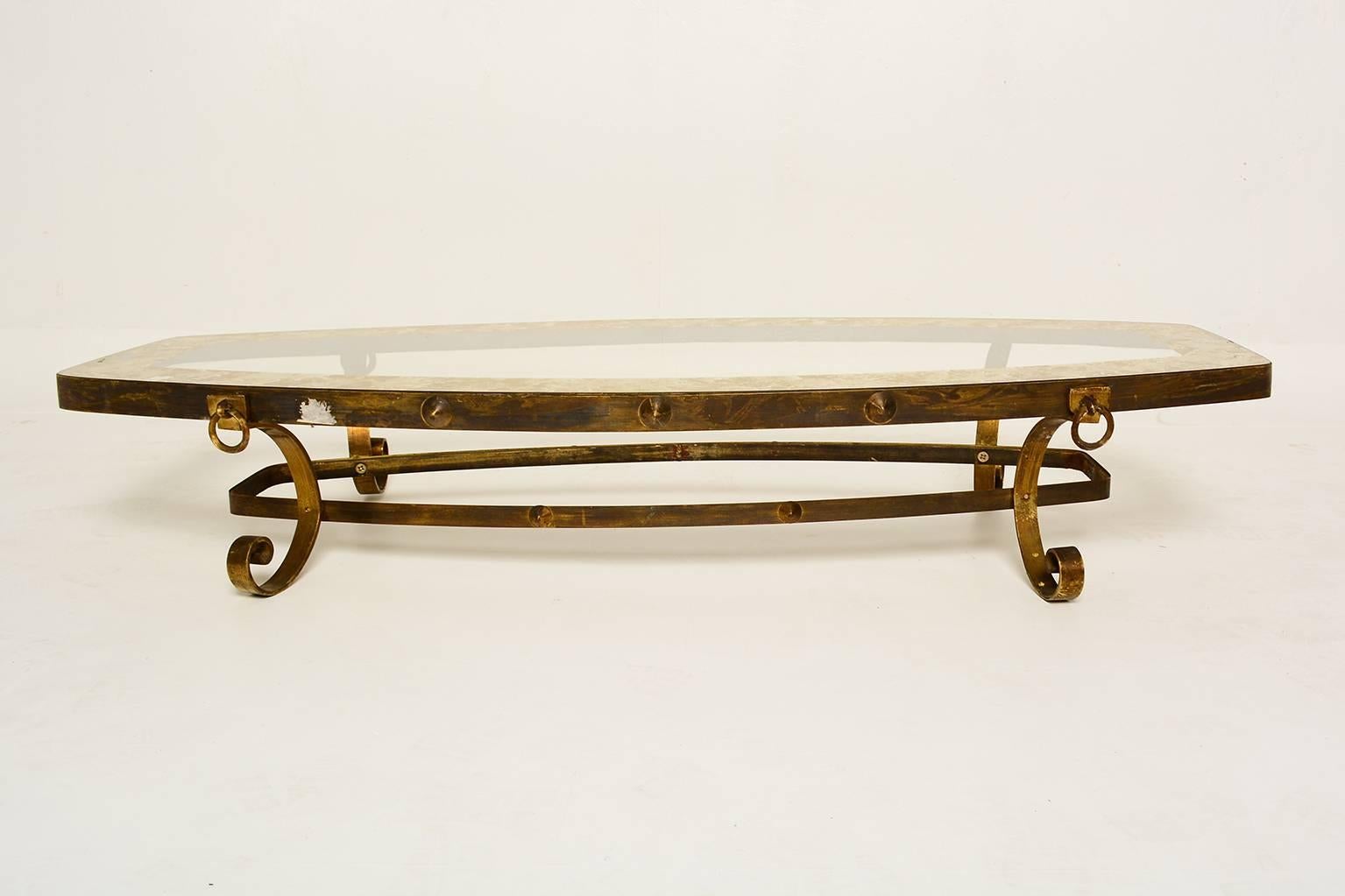 For your consideration a coffee table after Arturo Pani. 
Rectangular mixed with oval shape. Sculptural legs in solid brass. 

Brass decorative ornaments. 

Unmarked.