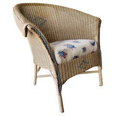 Silla de patio de mimbre vintage Lloyd Loom de los años 50