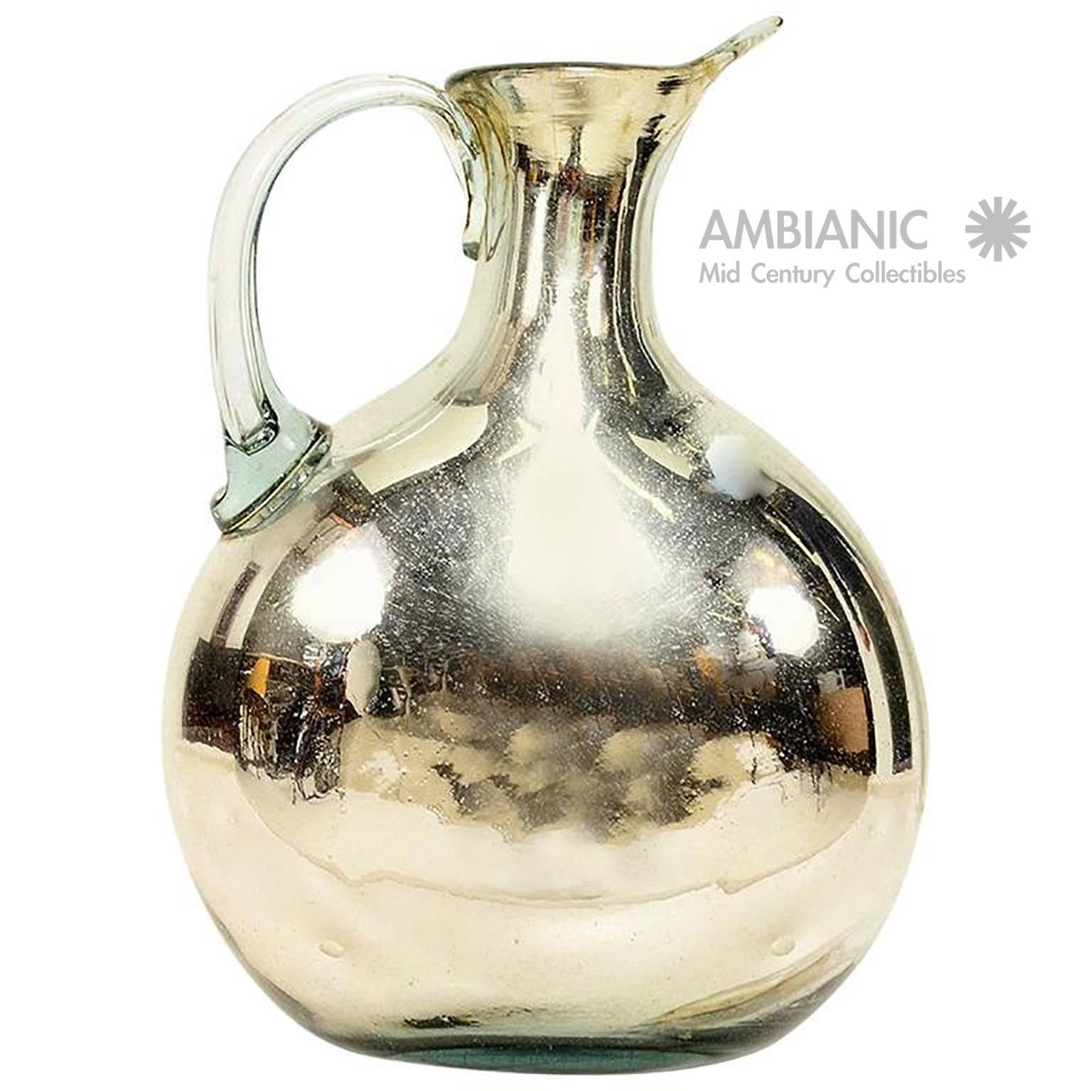 For your consideration a vintage pitcher made of mercury glass.
Measures: 16 1/2